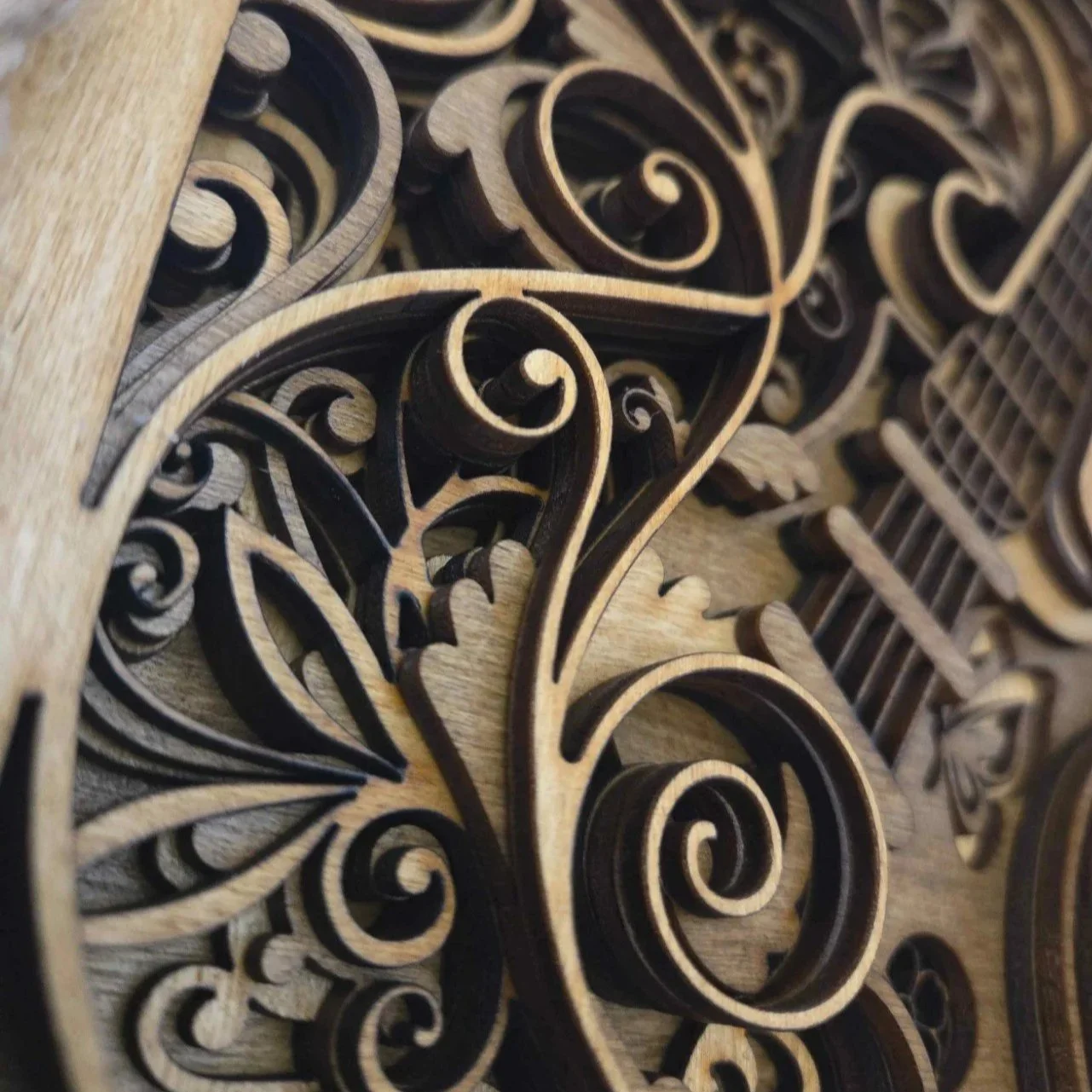 Close-up: Detail of 7 layers of natural and dark oak wood, precision-cut in Kent, United Kingdom.