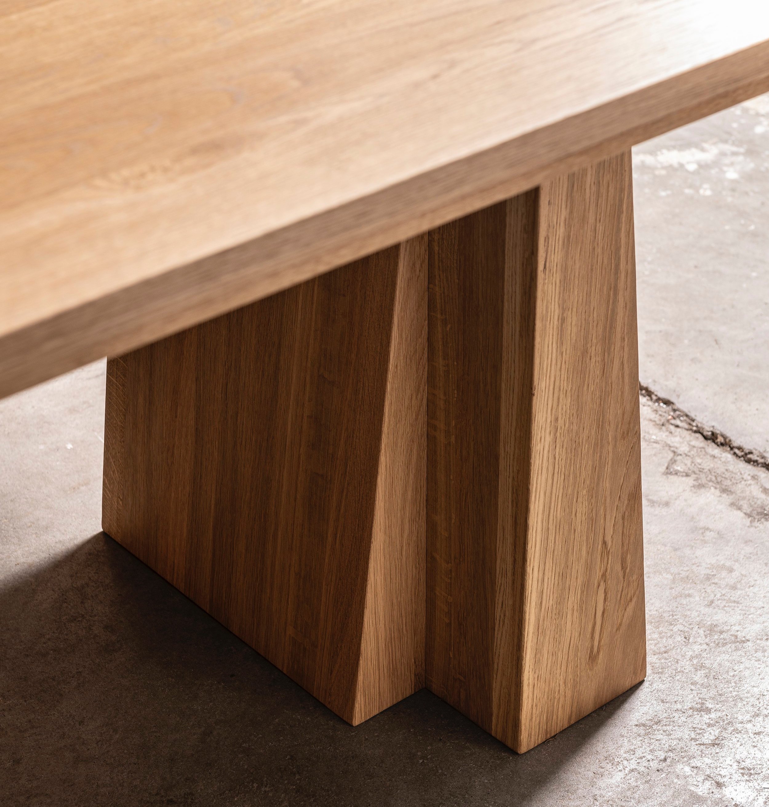 An image of a dining table leg detail .