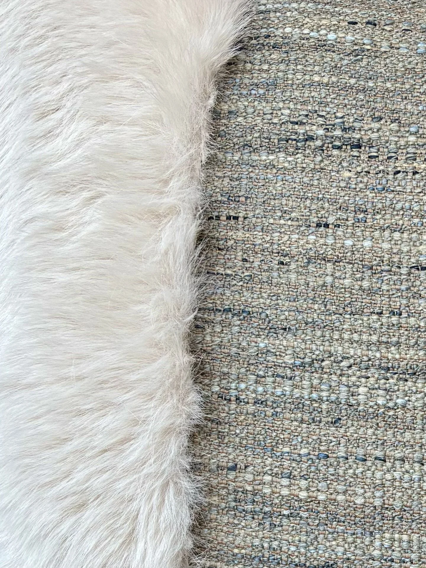 an image of a cushion cover with a linen fabric combined with faux-fur.