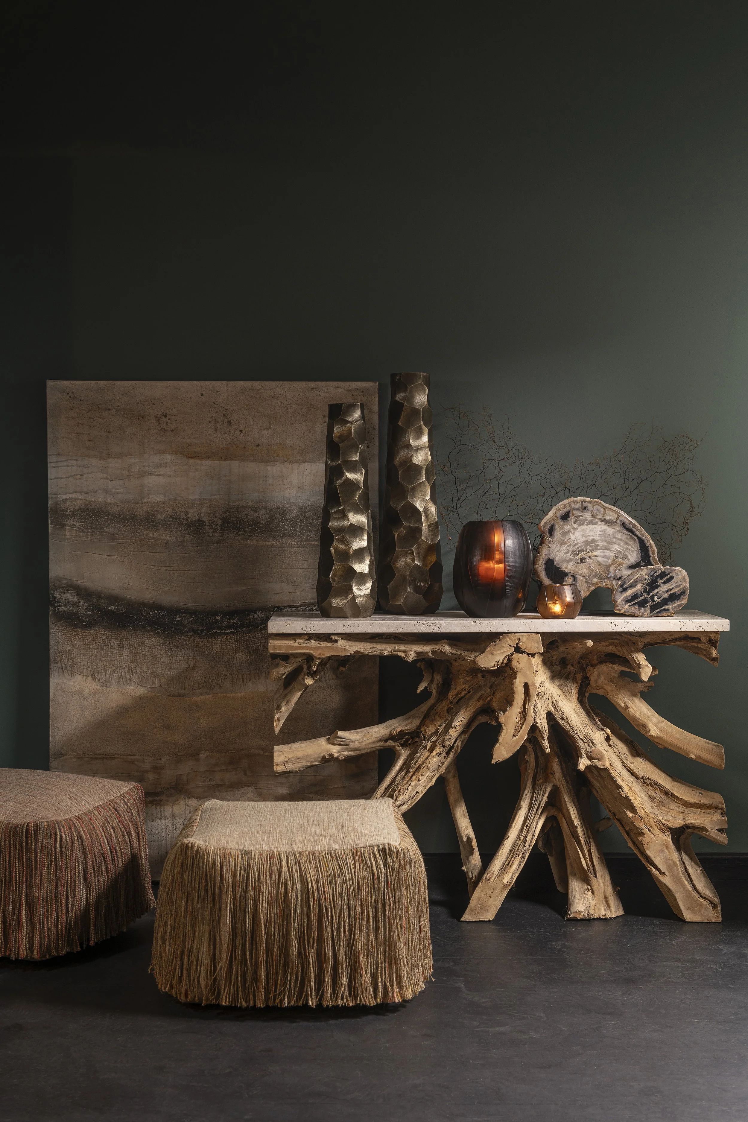 An image of a side table in teak wood with some stock items and one of a kind decorations.