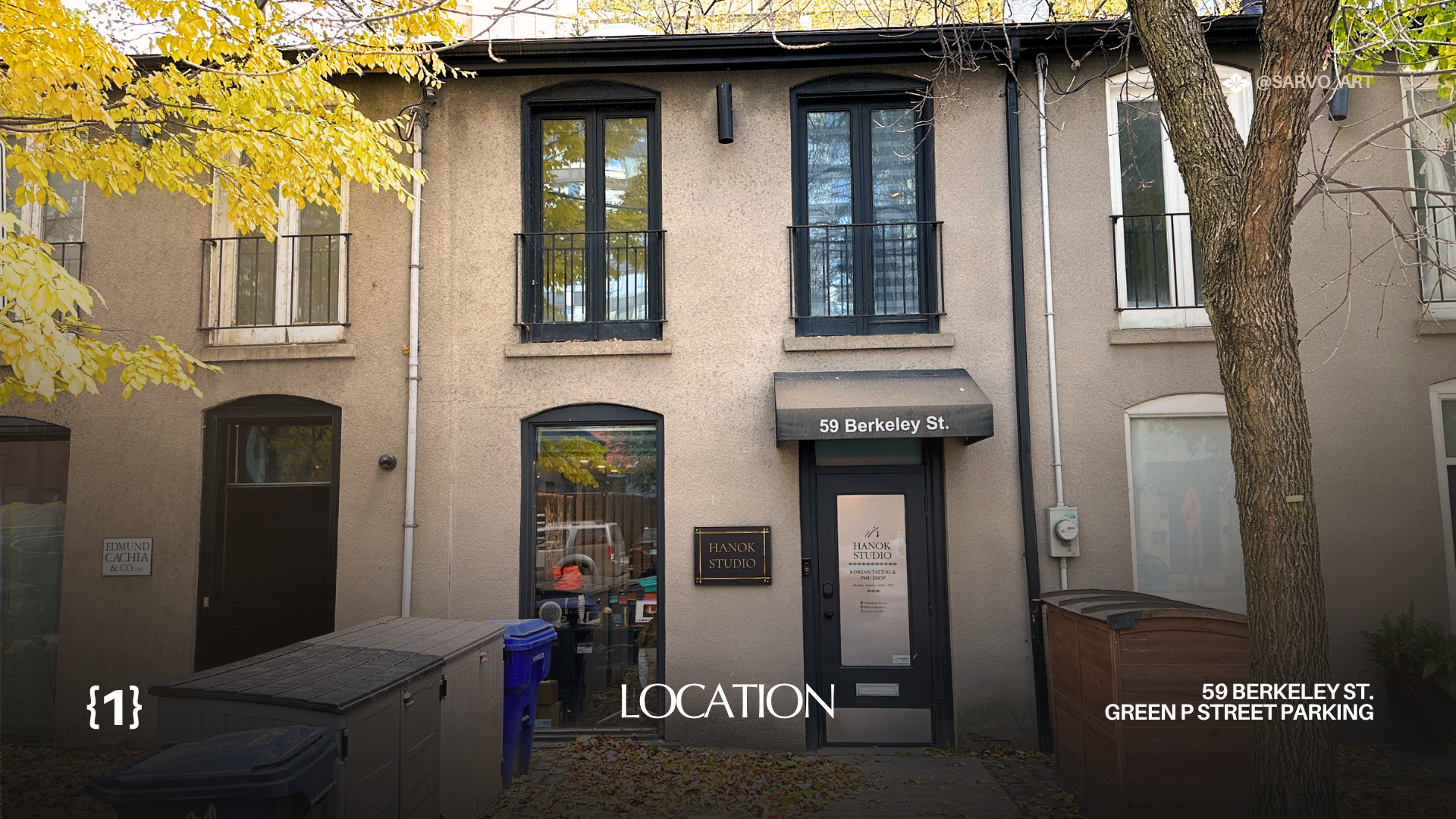 Front view of a beige building with black-framed windows, a sign reading 'HANOK STUDIO', and a door with a sign for Korean tattoo and makeup services, located at 59 Berkeley Street. There are trees with yellow leaves and some trash bins on the sidewa