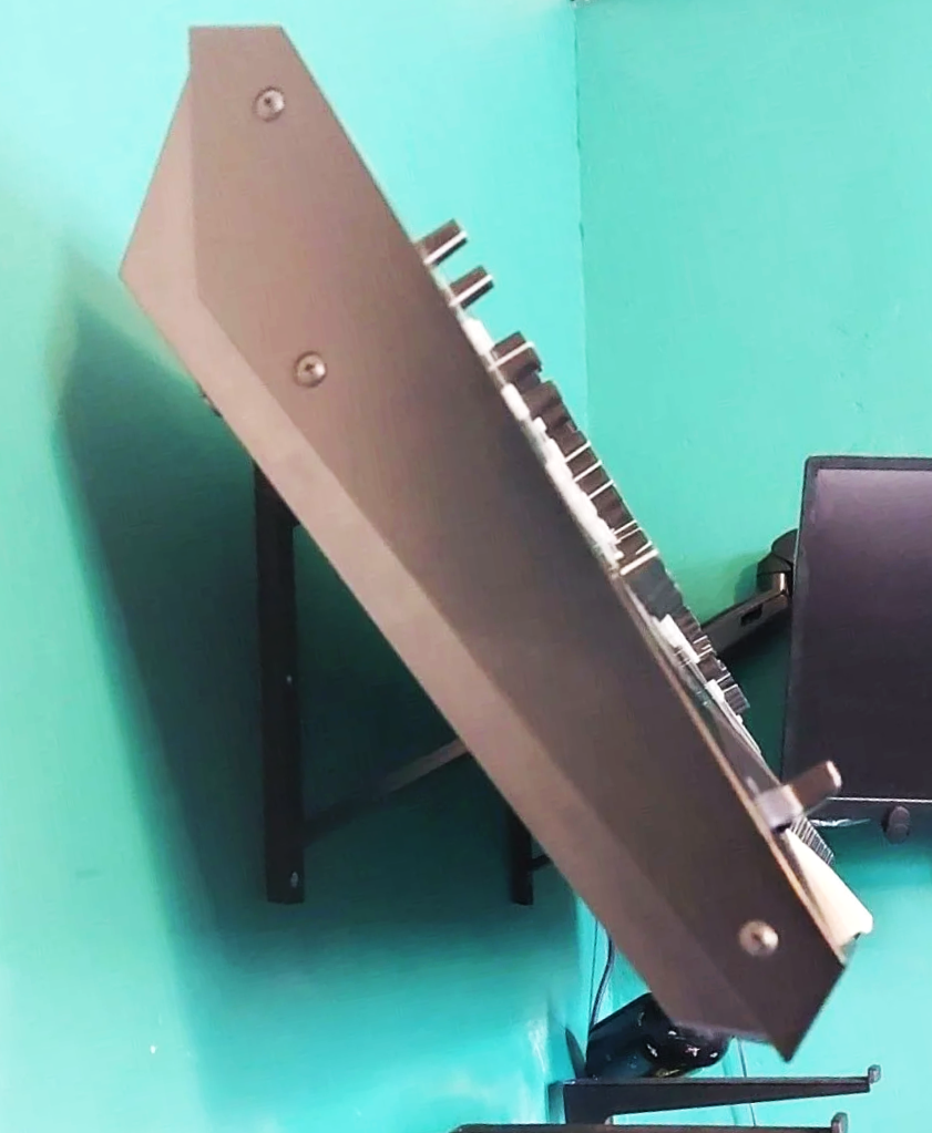 Wall mounted modular synth and drum machine support system for studio workflows