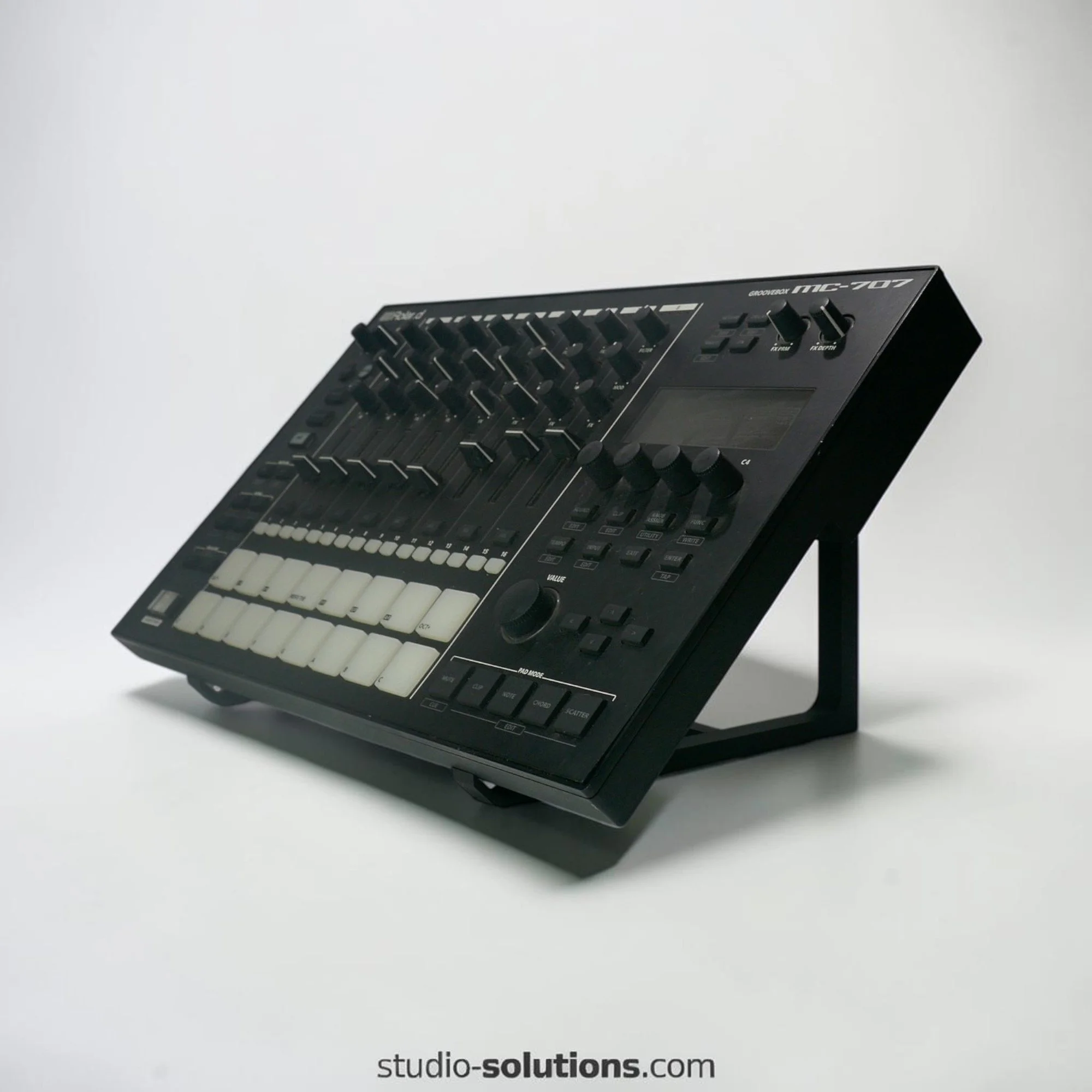 Angled groovebox stand for Roland MC-707 studio desk setup