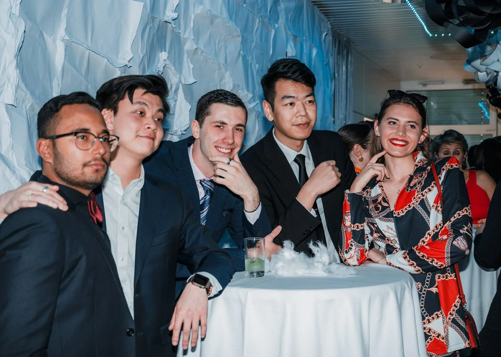 Laurie’s customers, Mariana and Carmen holding hands on a green lawn on their wedding day.