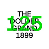 A logo for The Dodge Grand with the year 1899 and the number 15 in green, black, and white colors.