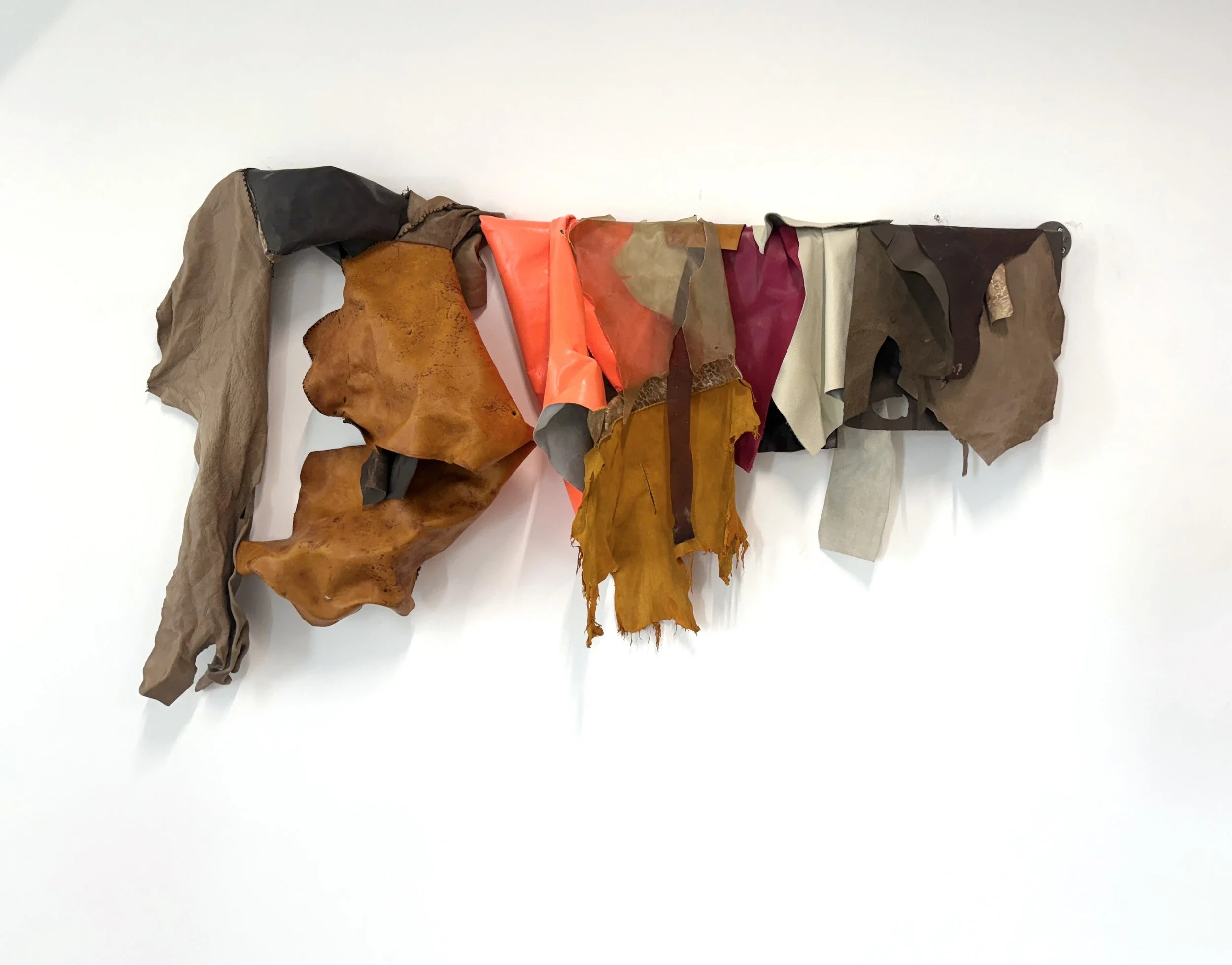 Leather Rack 3, 2025, the artist's collection of leather, 30" x 38" x 14"