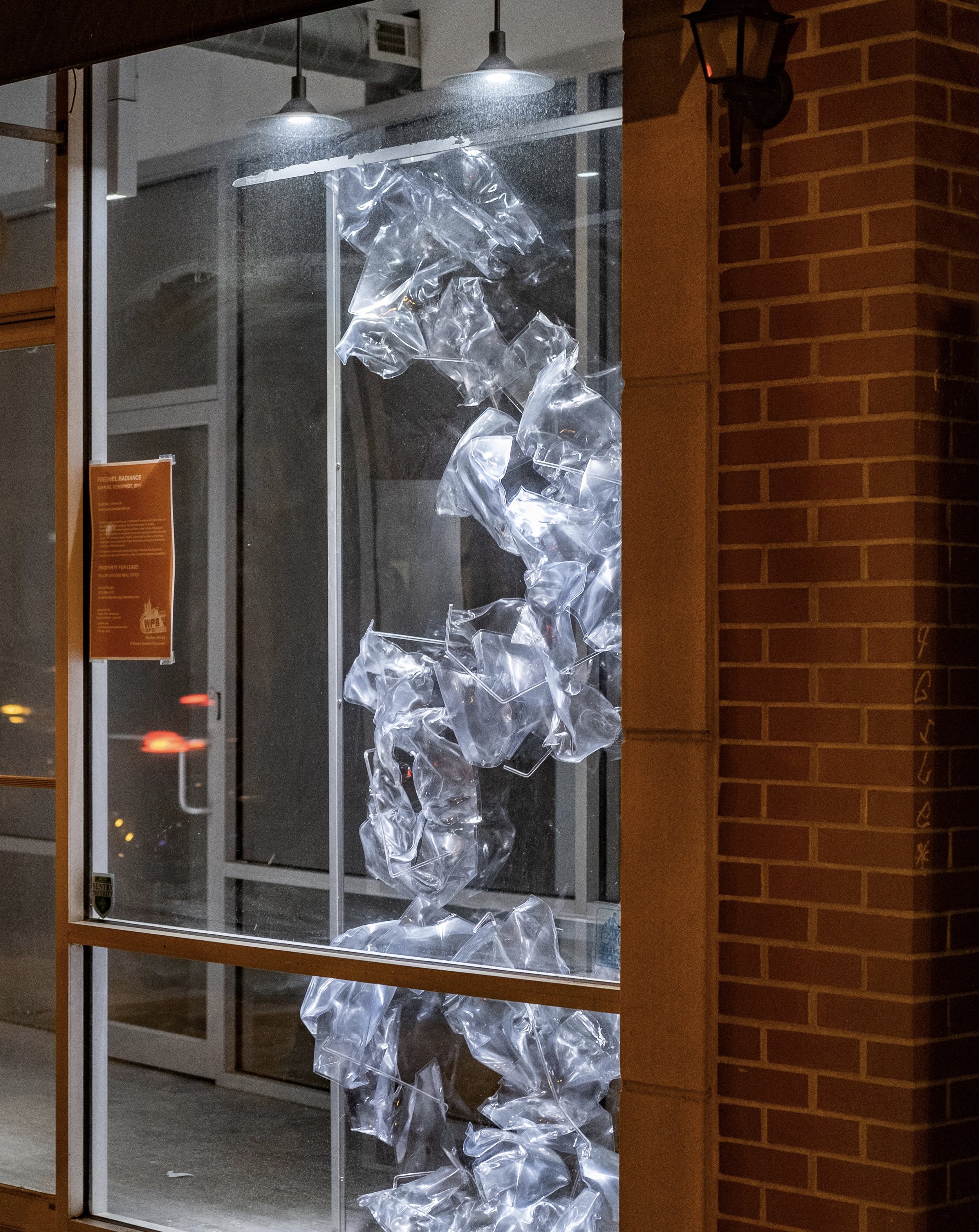 Window Works: Fresnel Radiance, 2019, fresnel lenses, polycarbonate, aluminum, site-specific installation in storefront in Bucktown, Chicago. Dimensions variable.
