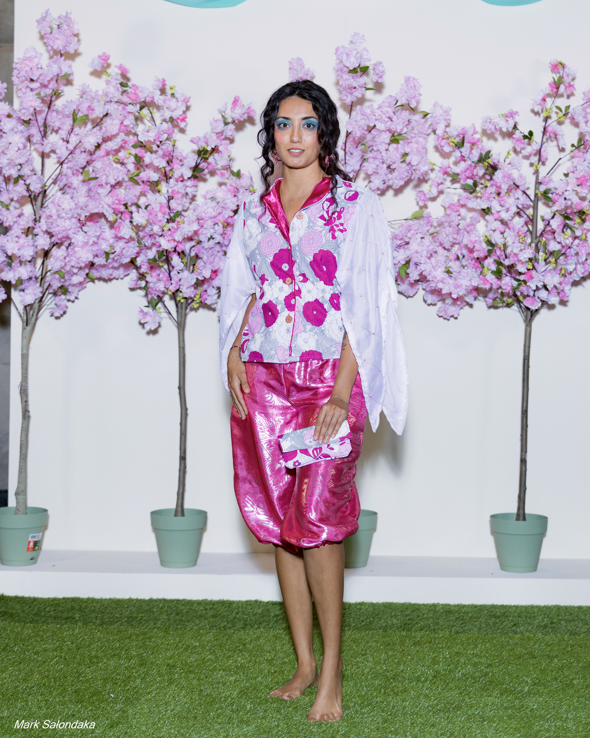 Model: Dani. Wearing: Cinched Capris and Split-Sleeve Top, with matching clutch 