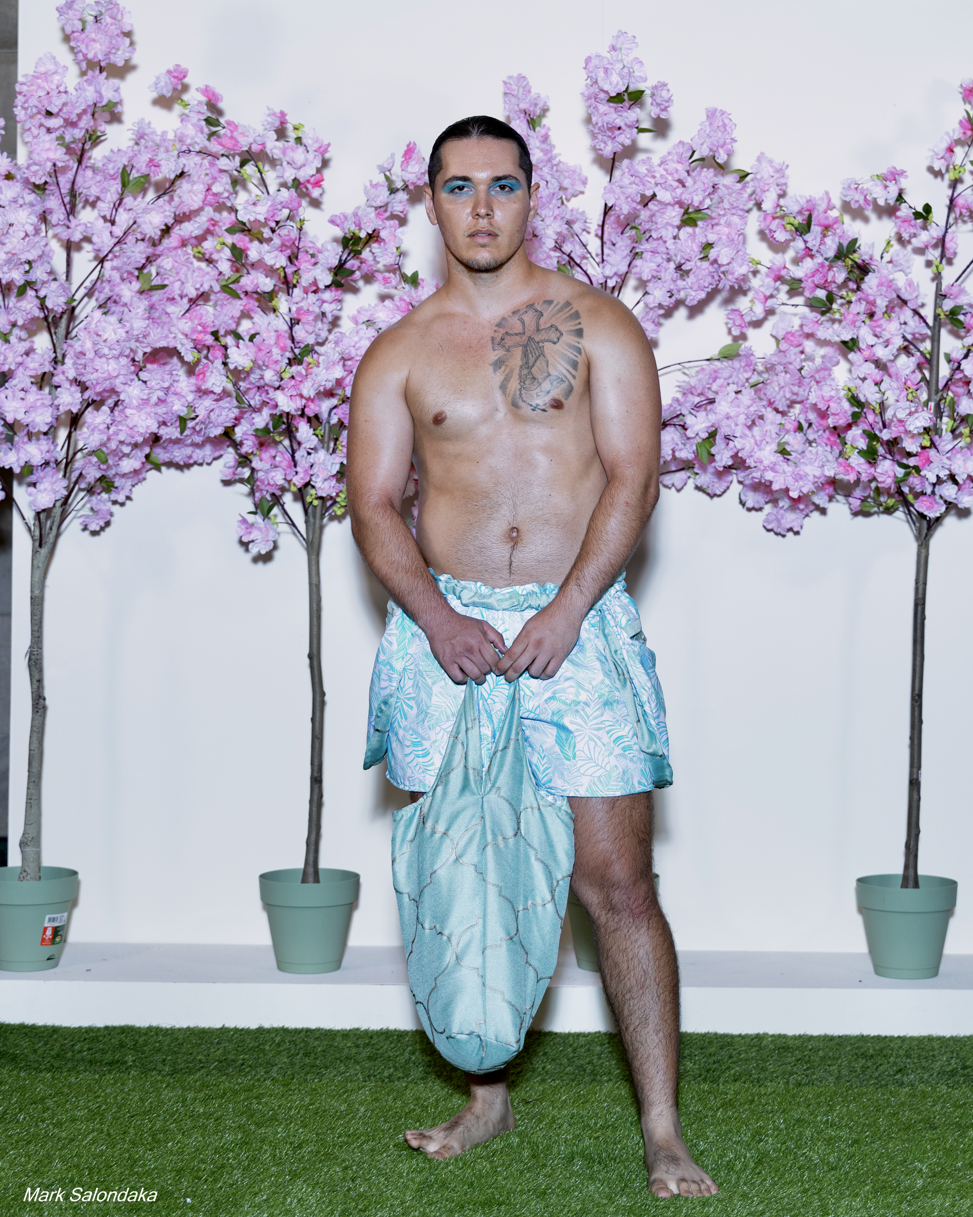 Model: Justin. Wearing: Flap Shorts with matching tote (stuffed with blanket and pillow)