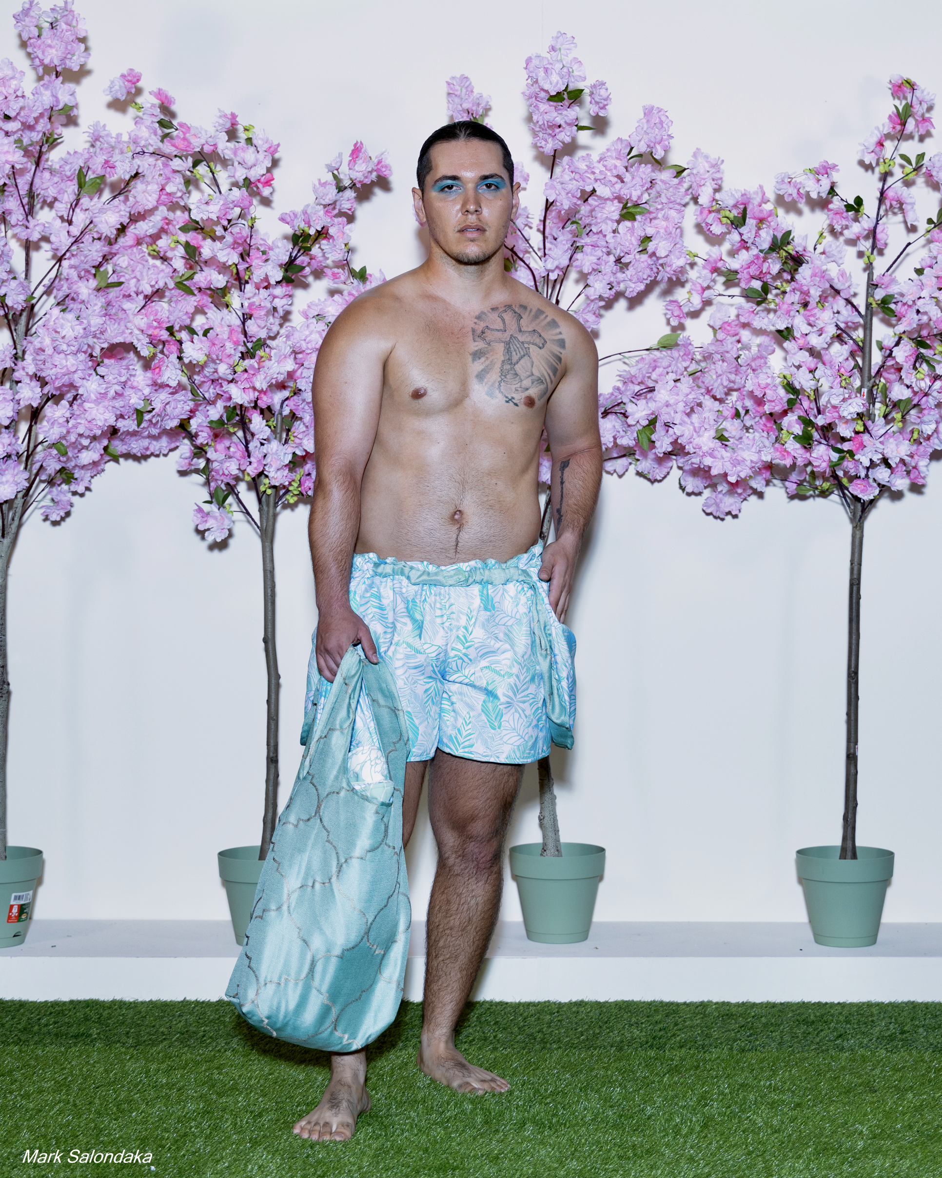 Model: Justin. Wearing: Flap Shorts with matching tote (stuffed with blanket and pillow)