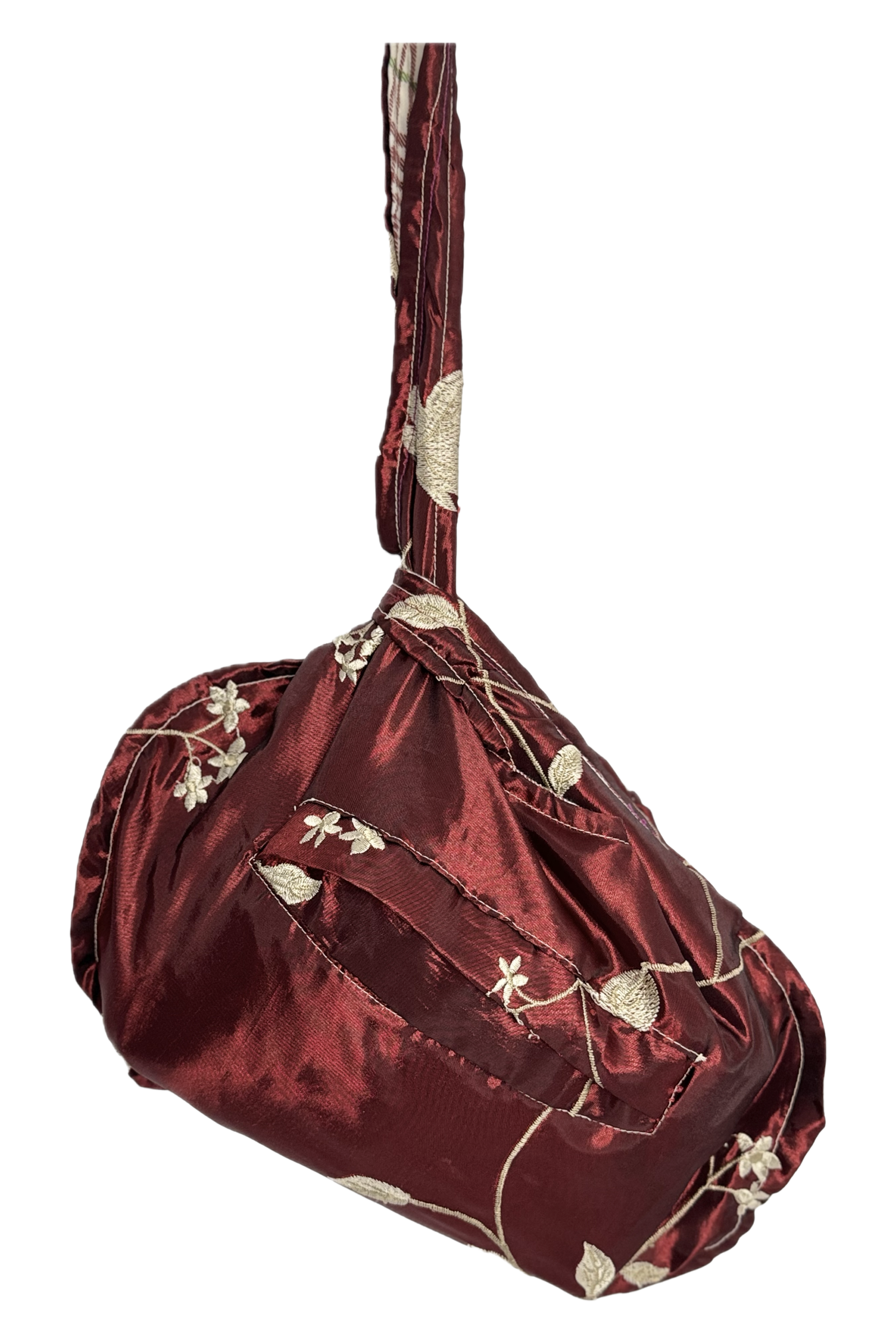 A plaid shirt with blue, white, and red checks draped over a beige mannequin torso, partially unbuttoned with the front pocket visible.