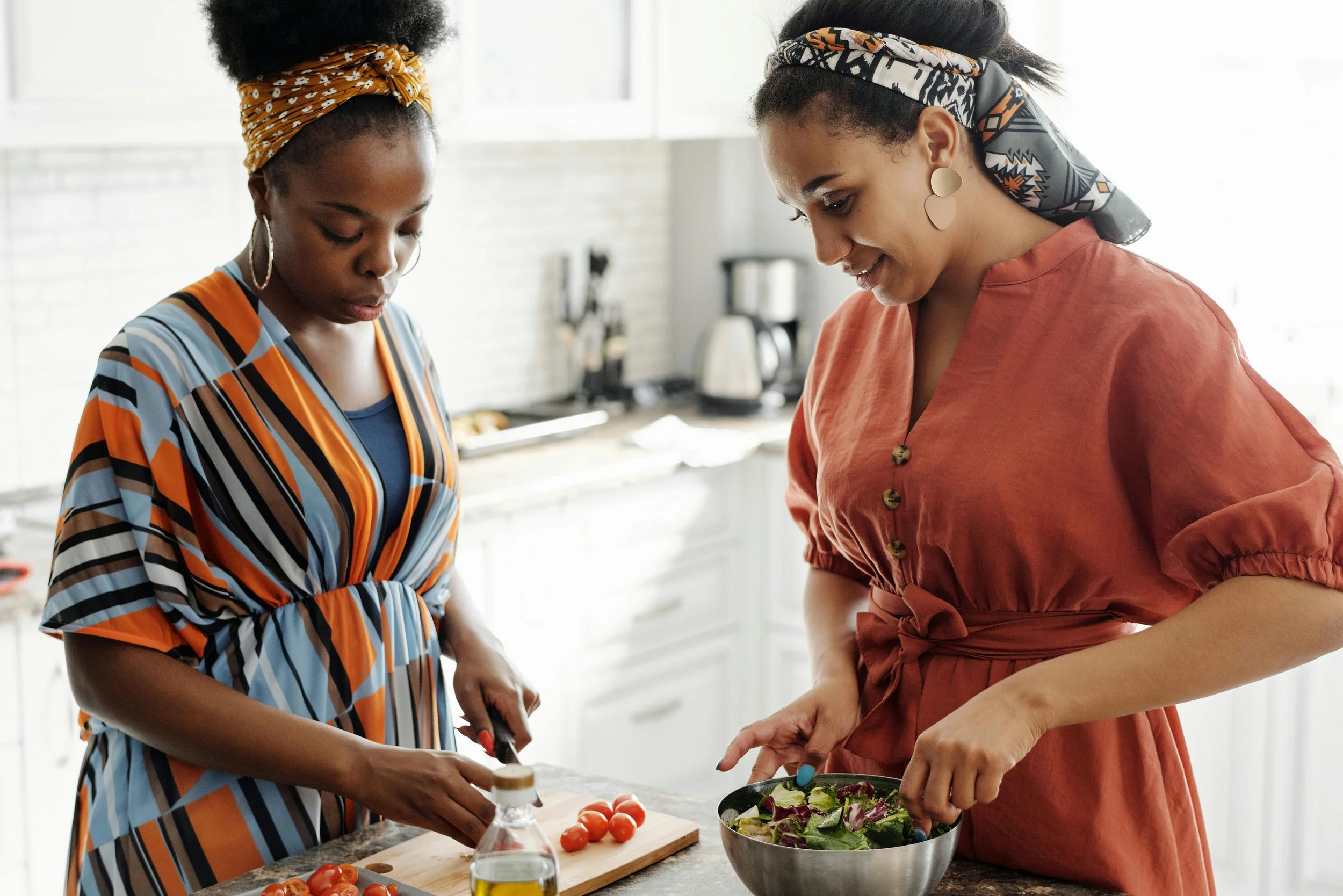 Two woman preparing a meal together, representing grief and family estrangement without reconciliation pressure.