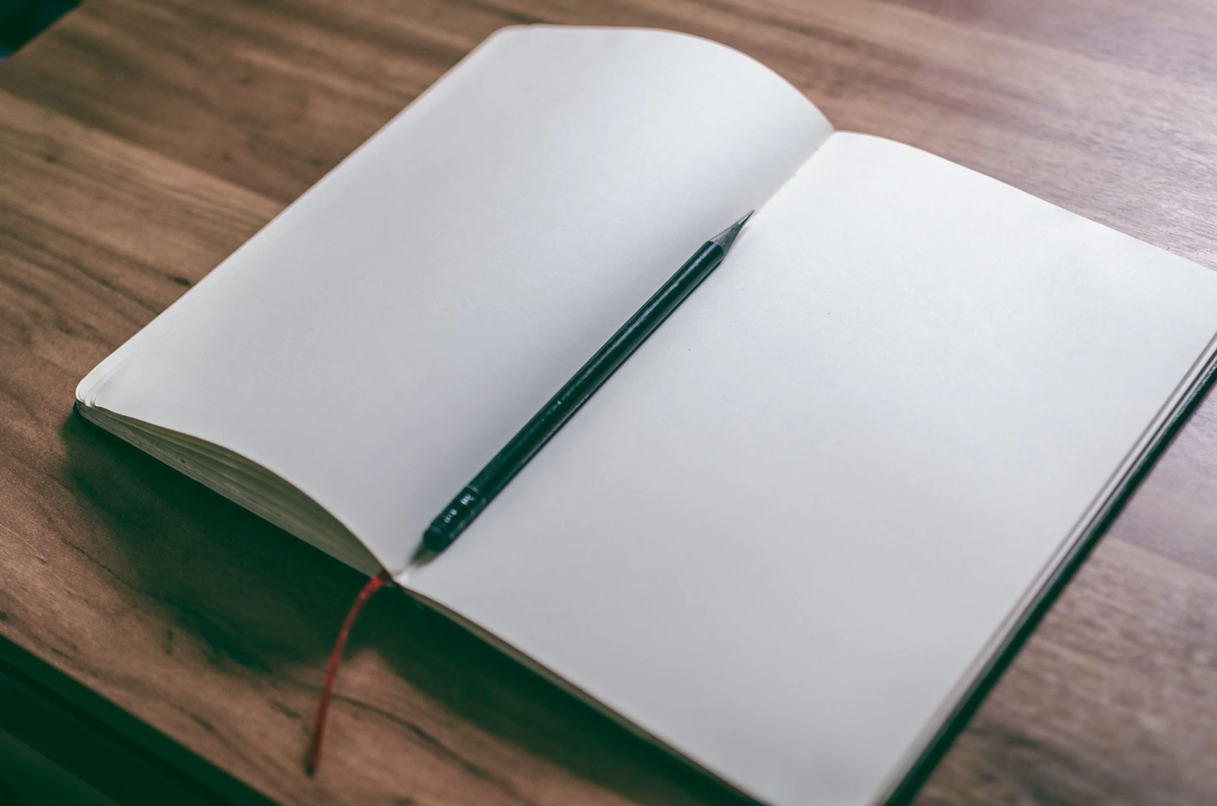 An open journal and pen on a table, symbolizing the private reckoning many women in coercive control marriages do alone