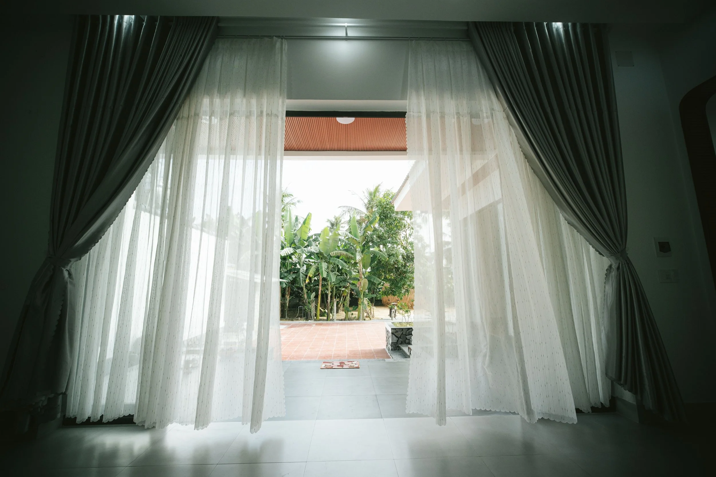 An open door with warm light coming through, suggesting an invitation forward