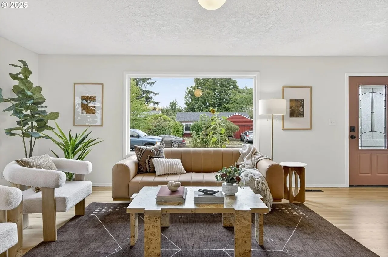 Living room with a modern brutalist burl wood coffee table mixed with traditional furniture to create a beautiful home aesthetic