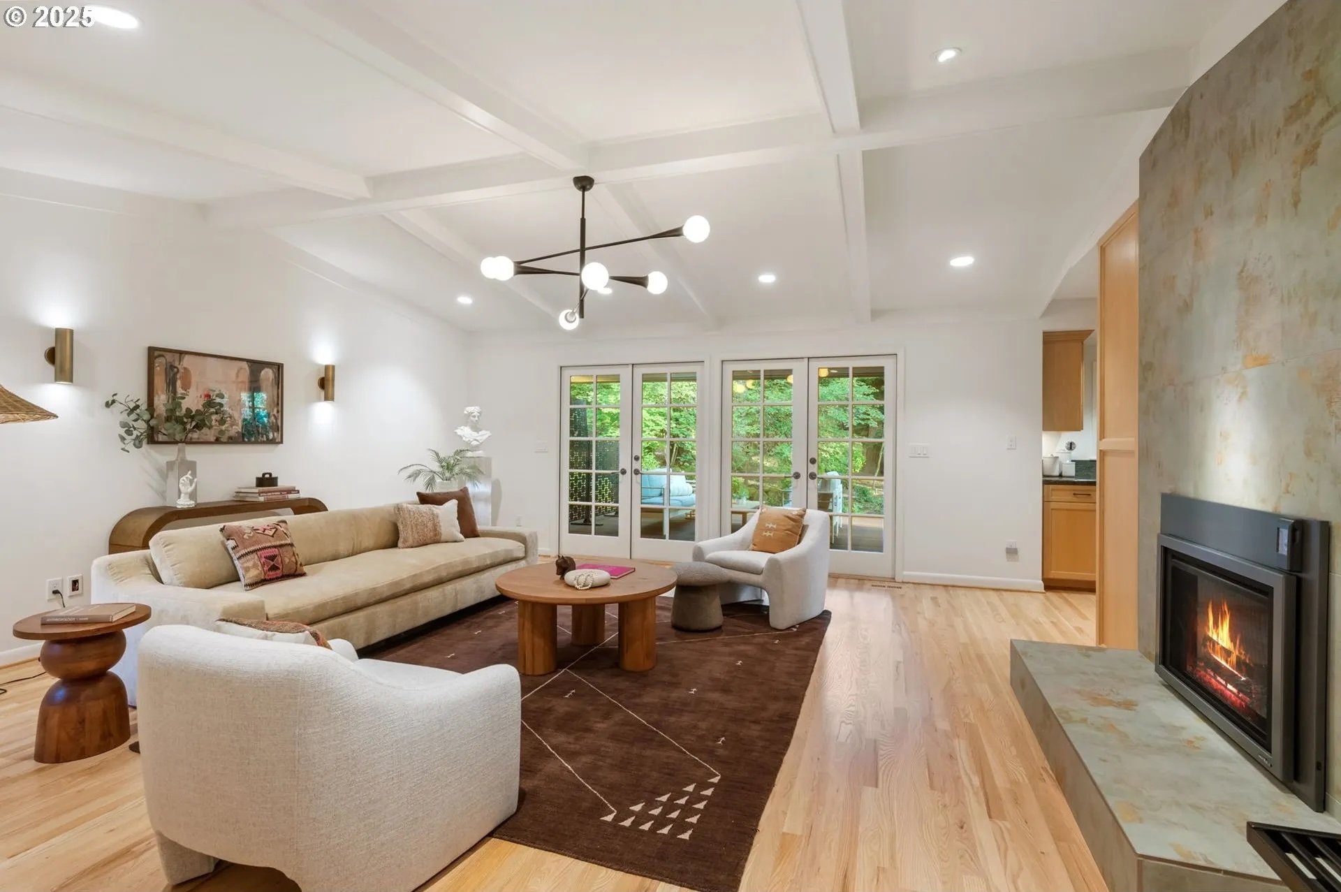 A dark rug and unique artwork anchor the staged living room an uber modern designer home in the upper million dollar price point in Lake Oswego Oregon. 