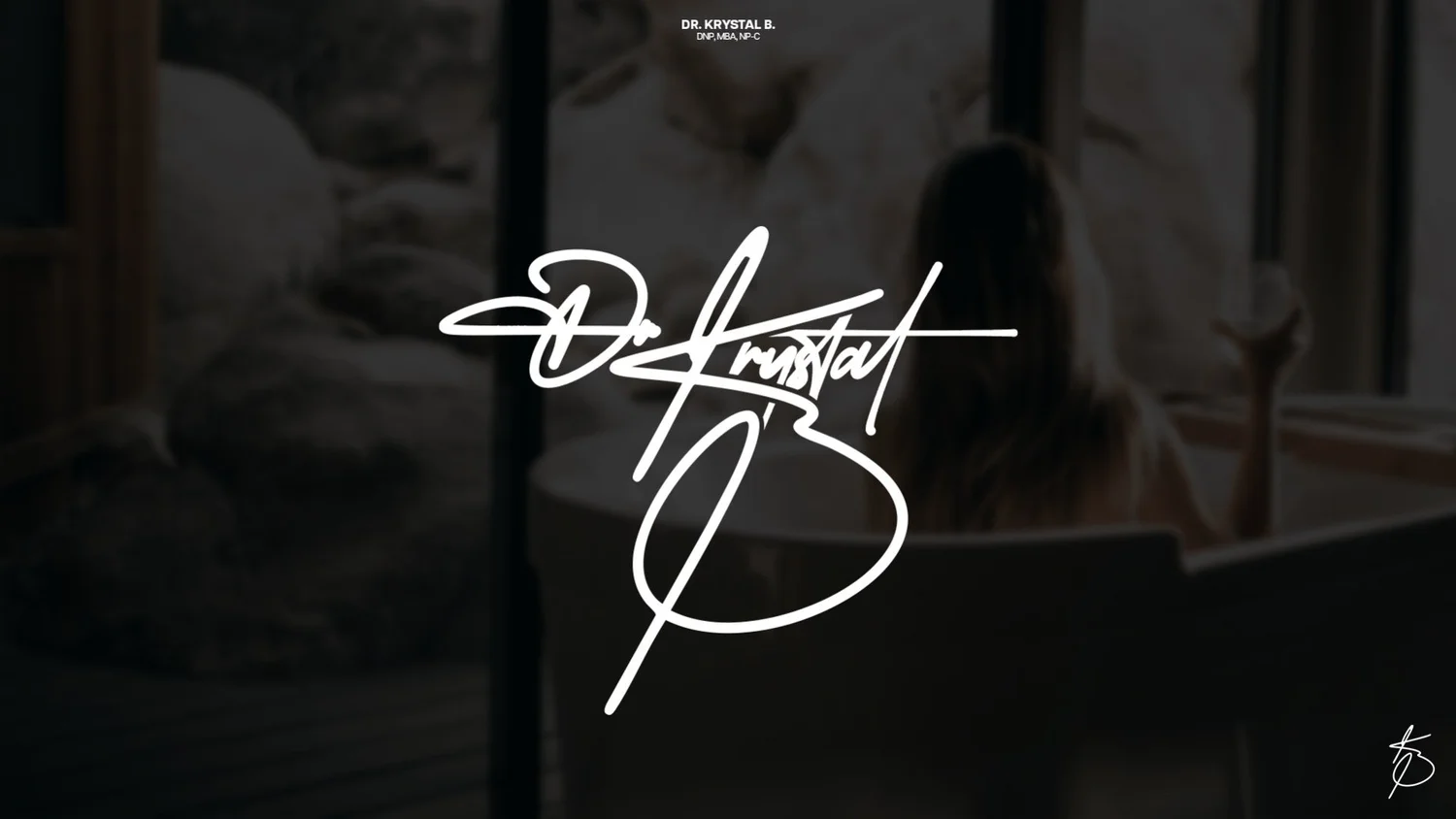 Dr. Krystal B signature logo in white over a soft dark photo