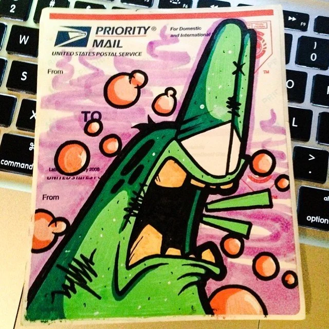 Hand-drawn green Derp graffiti sticker on a USPS Priority Mail Label 228, graffiti sticker art by Paul Vu