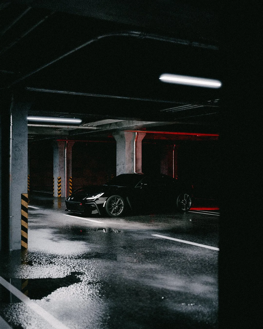 Black coupe in a dark garage with red wall light