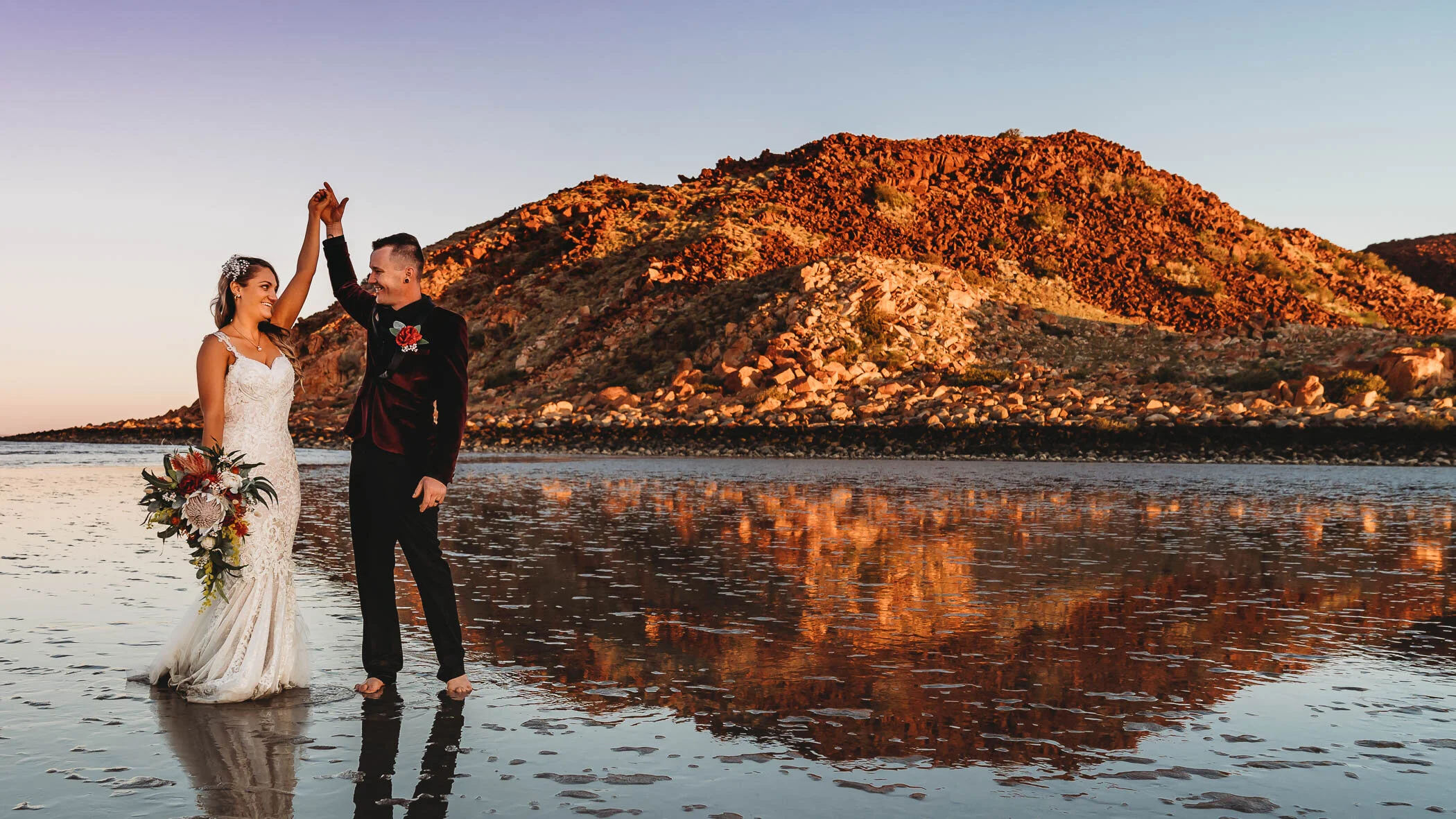 Couple dancing on the mudflats at Hearson's Cove on their wedding day