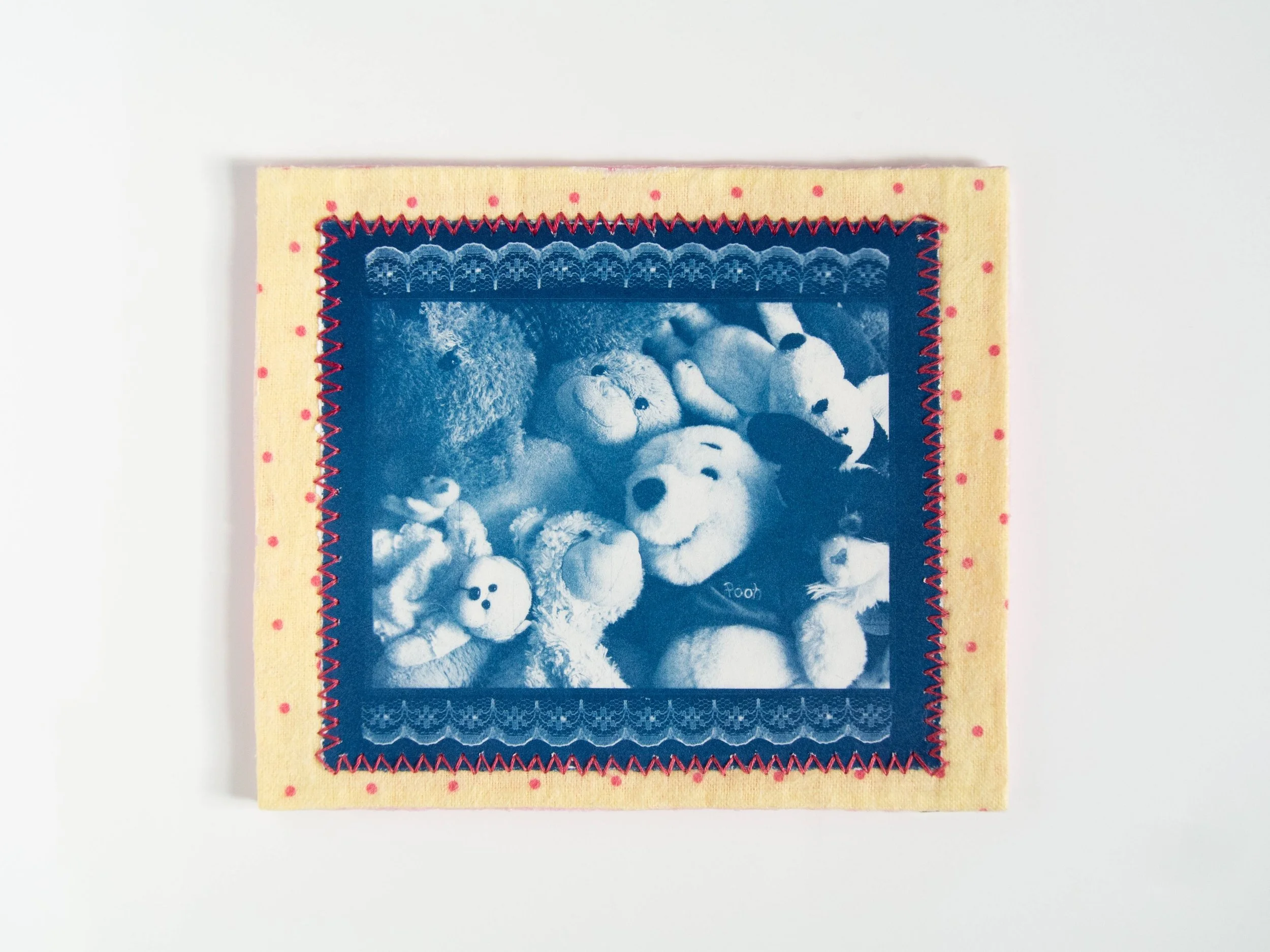 'soft toys feel like home,' 2026, Cyanotype and fabric embroidered with cotton thread, 15.5cm x 18.3cm 