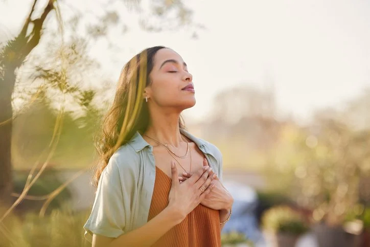 Woman with her hands on her heart. Image conveys peace - Sex Therapy in Scottsdale, AZ - Sex therapy in Tuscon, AZ sex therapist - online sex therapy arizona -sex therapy arizona - emdr sex therapy - 85253 - 85262 - 85225-85718-85755-85749