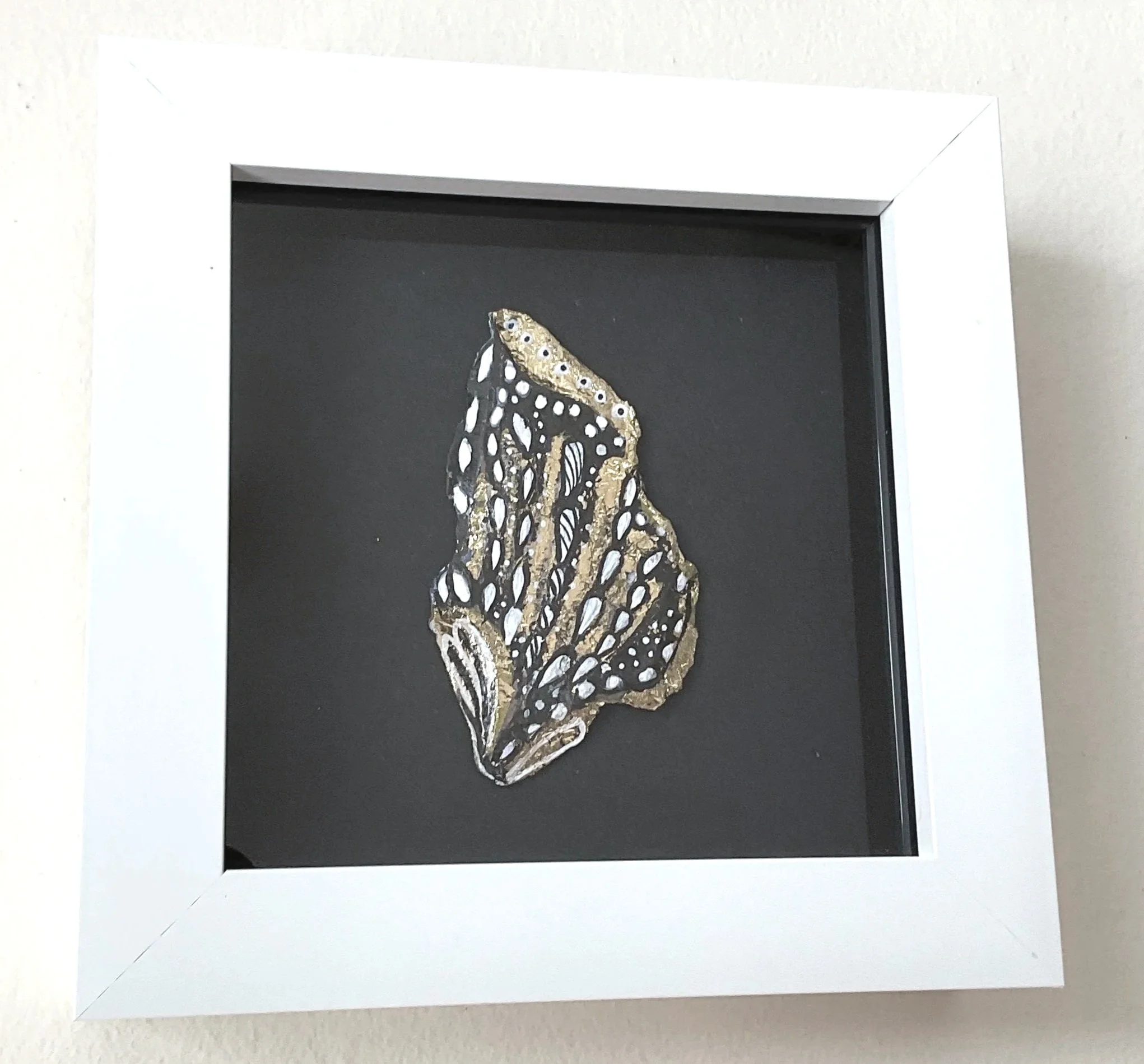 Broken Wing, framed original bark painting by Roxy Megyesi, gold leaf and black ink on found bark, Bark and Grain series, 2025