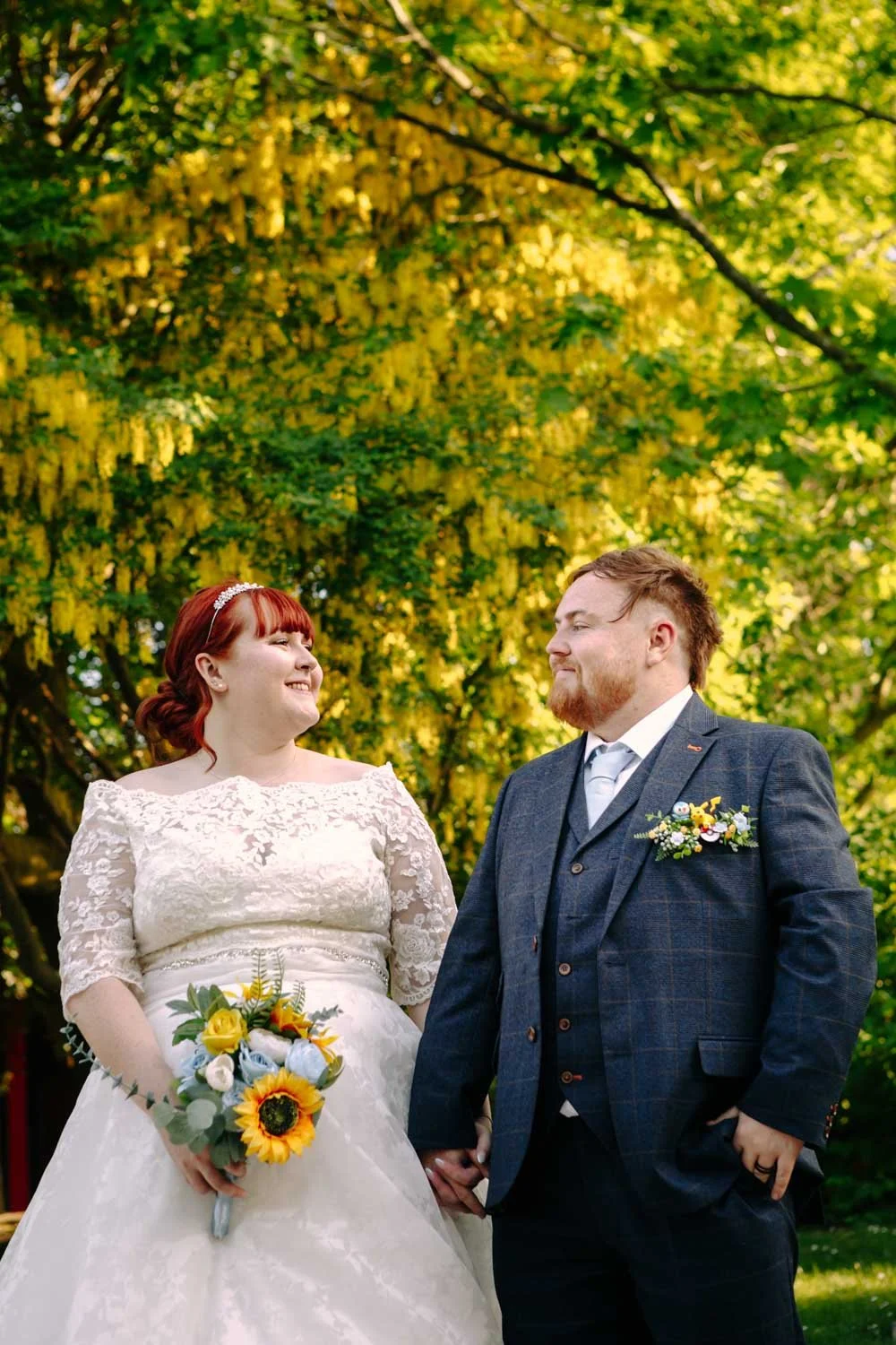 bride and groom with laburnum blossom in Nottingham