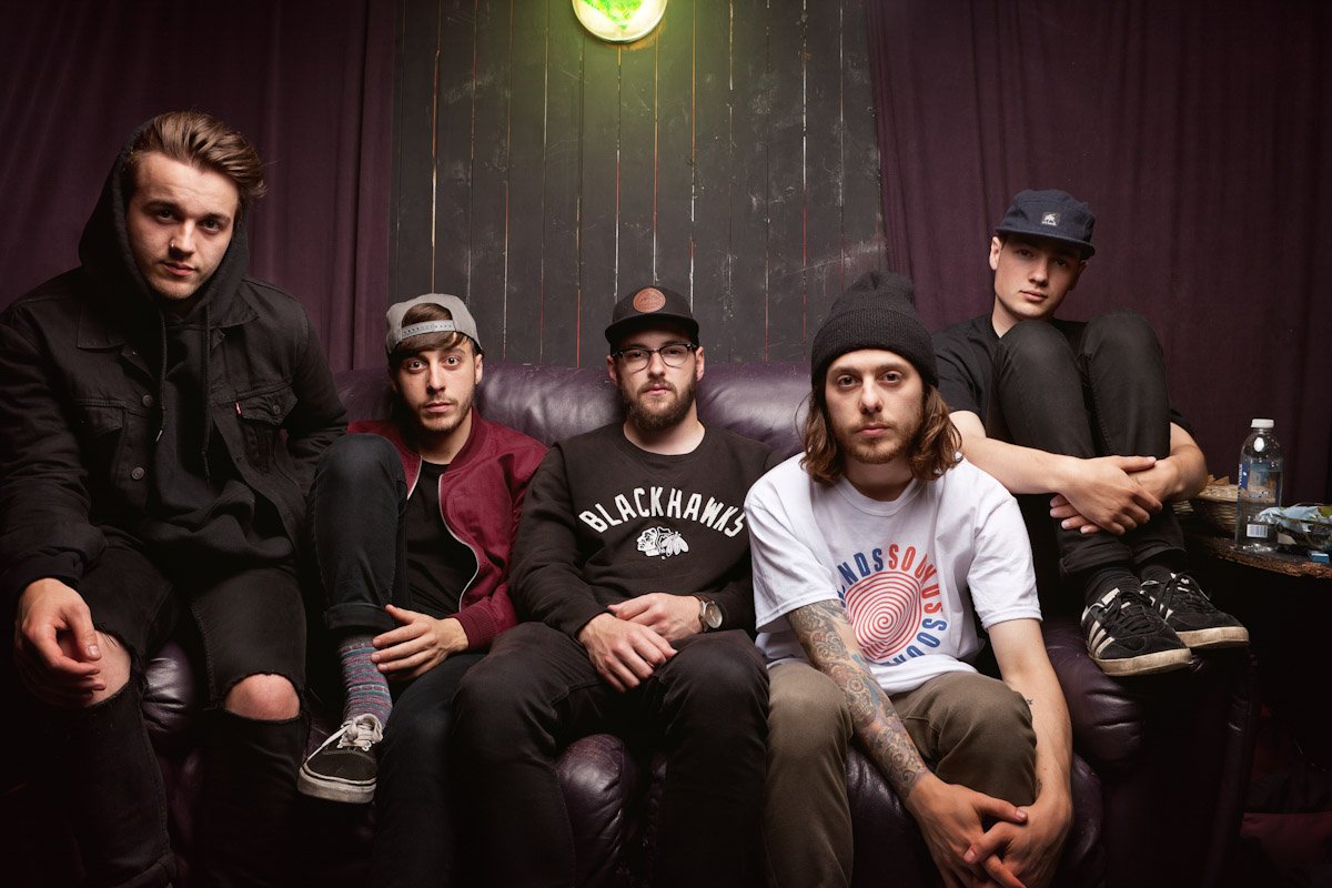 Blackpool band Boston Manor sit backstage at a gig in Derby
