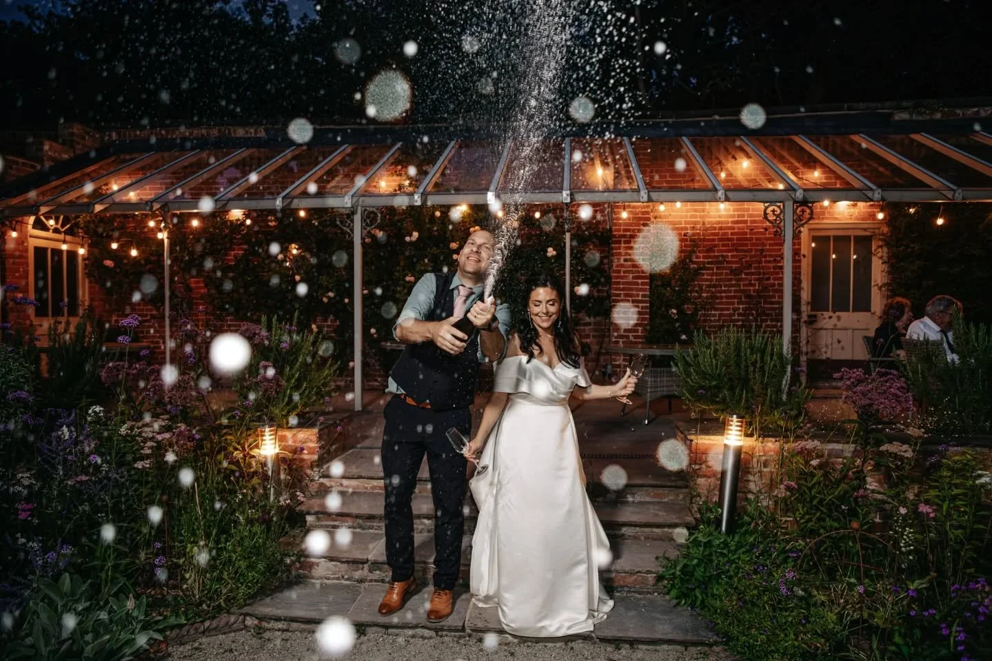 I love a champagne spray photo, they're so much fun to shoot, and look incredible. When else are you going to have an excuse to do one other than your wedding day (or winning the F1). Taken at the gorgeous @walledgardenatbeestonfields with Nicole and