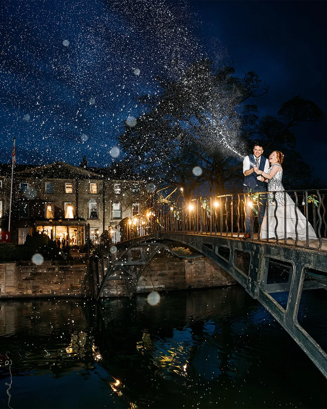 I love a good champagne spray photo, and I don't think any have been more dramatic than with Sarah and Alex at @watertonparkhotel back in April! This stunning venue comes on its own island in a lake, with just this footbridge connecting it to land. A