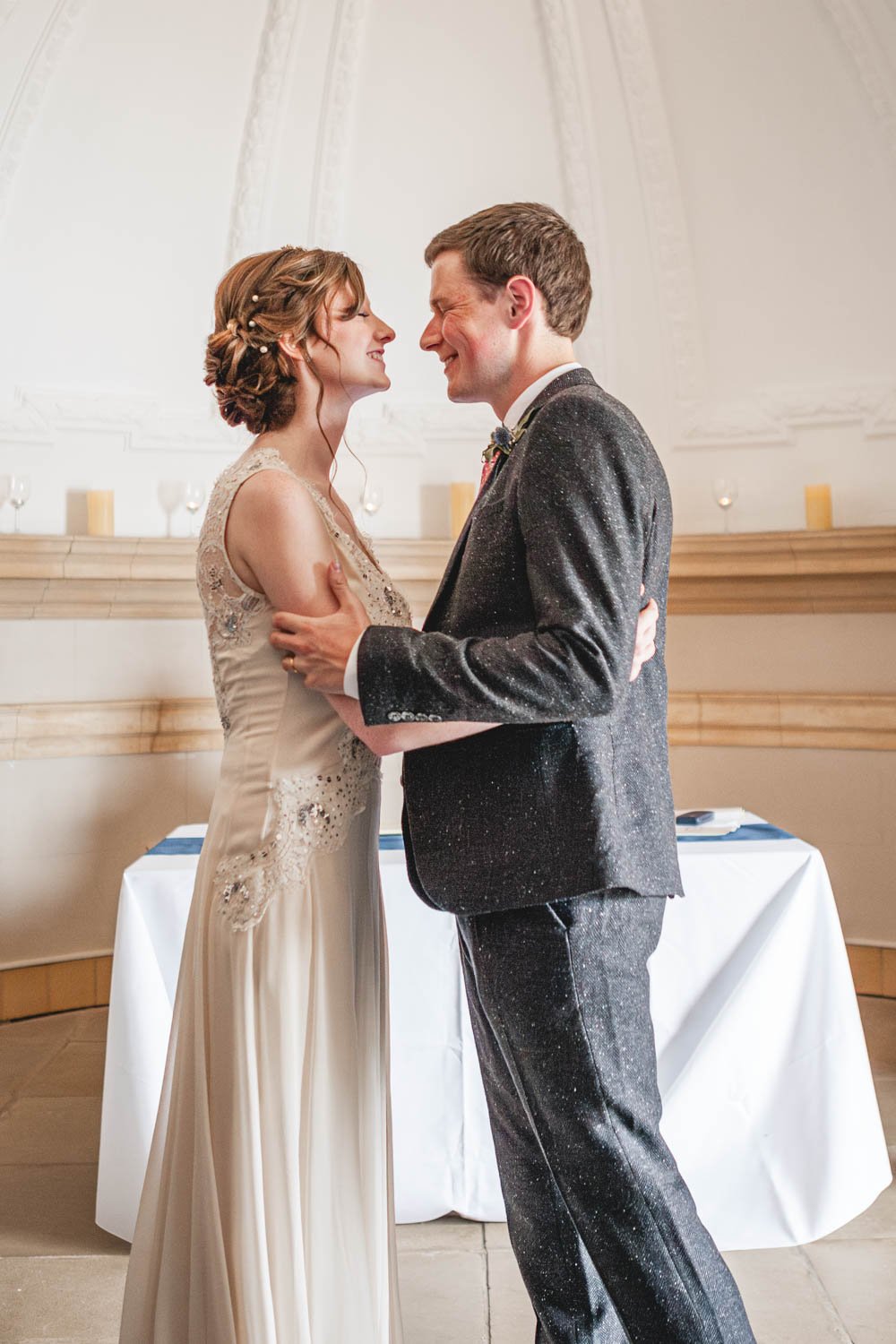 bride and groom embrace during wedding ceremony at Normanton church Rutland
