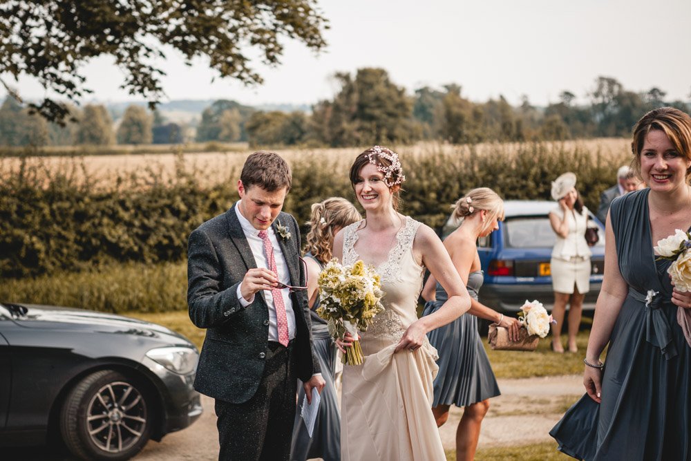 Bride and groom arrive at farmyard wedding reception