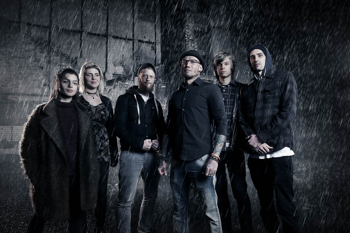 Skin City tattoo crew stand in the rain for a promo shot