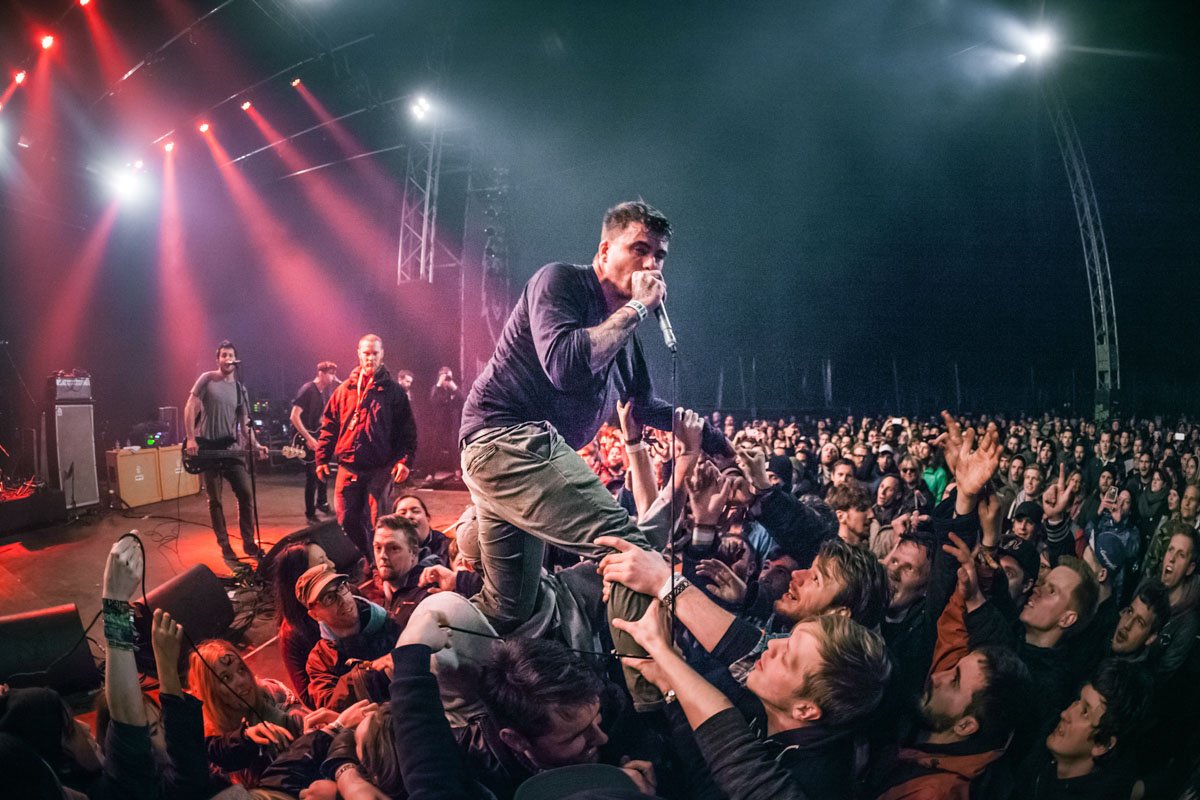 Anthony Green of the band Saosin climbs into the crowd at a show in Belgium