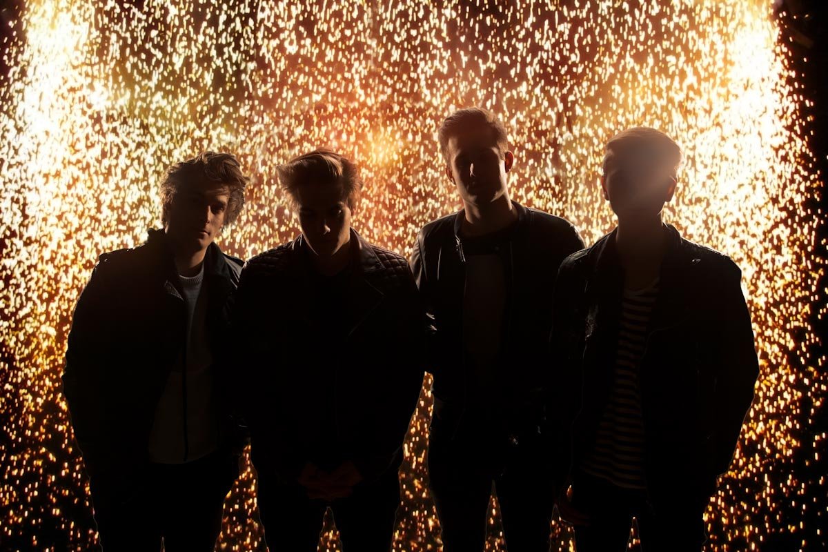 Derby band The Sparks stand in front of a shower of sparks