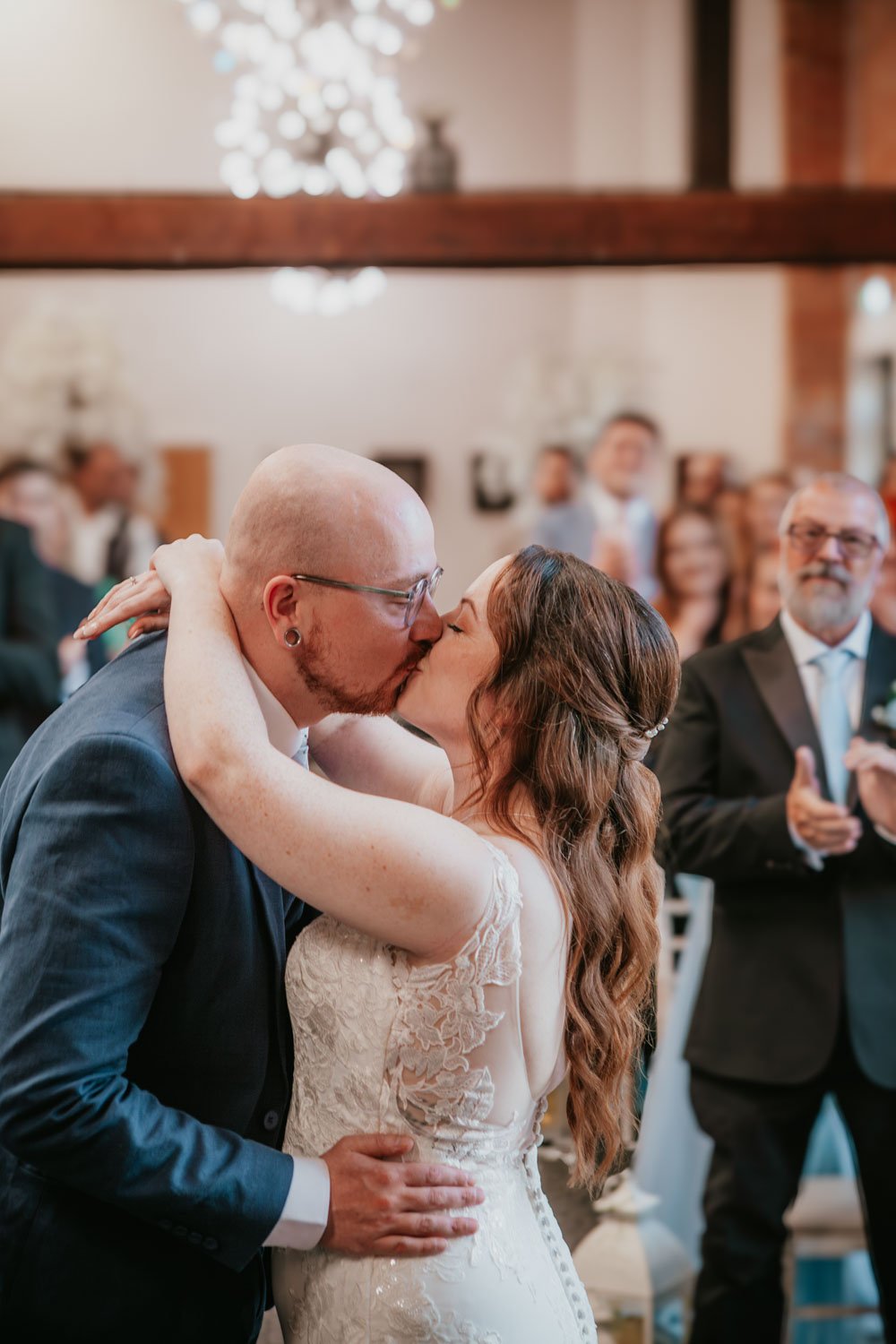 bride and groom first kiss in the Crystal Hall Goosedale