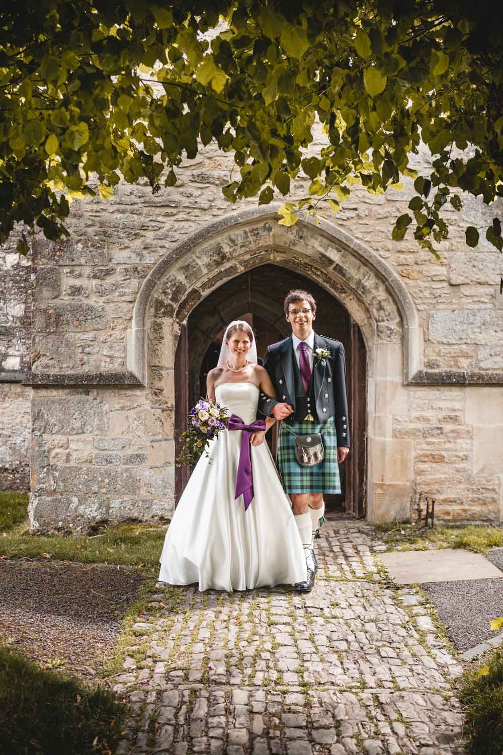 bride and groom at haddenham church, oxfordshire