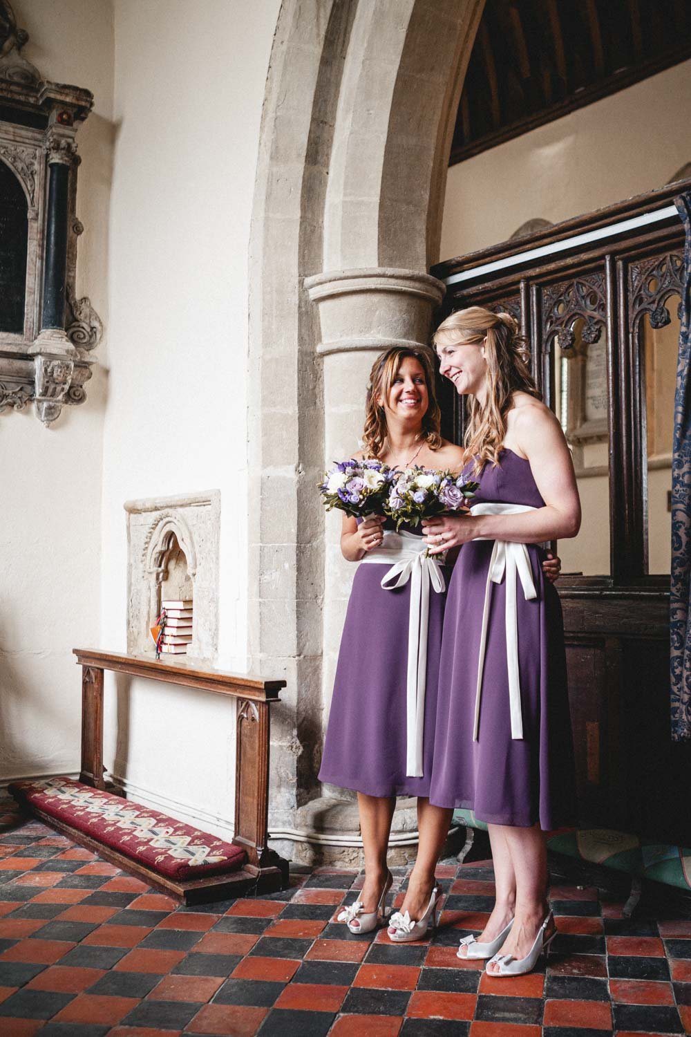 bridesmaids laugh in church