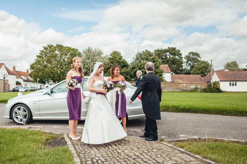 bride and bridesmaids arrive at church