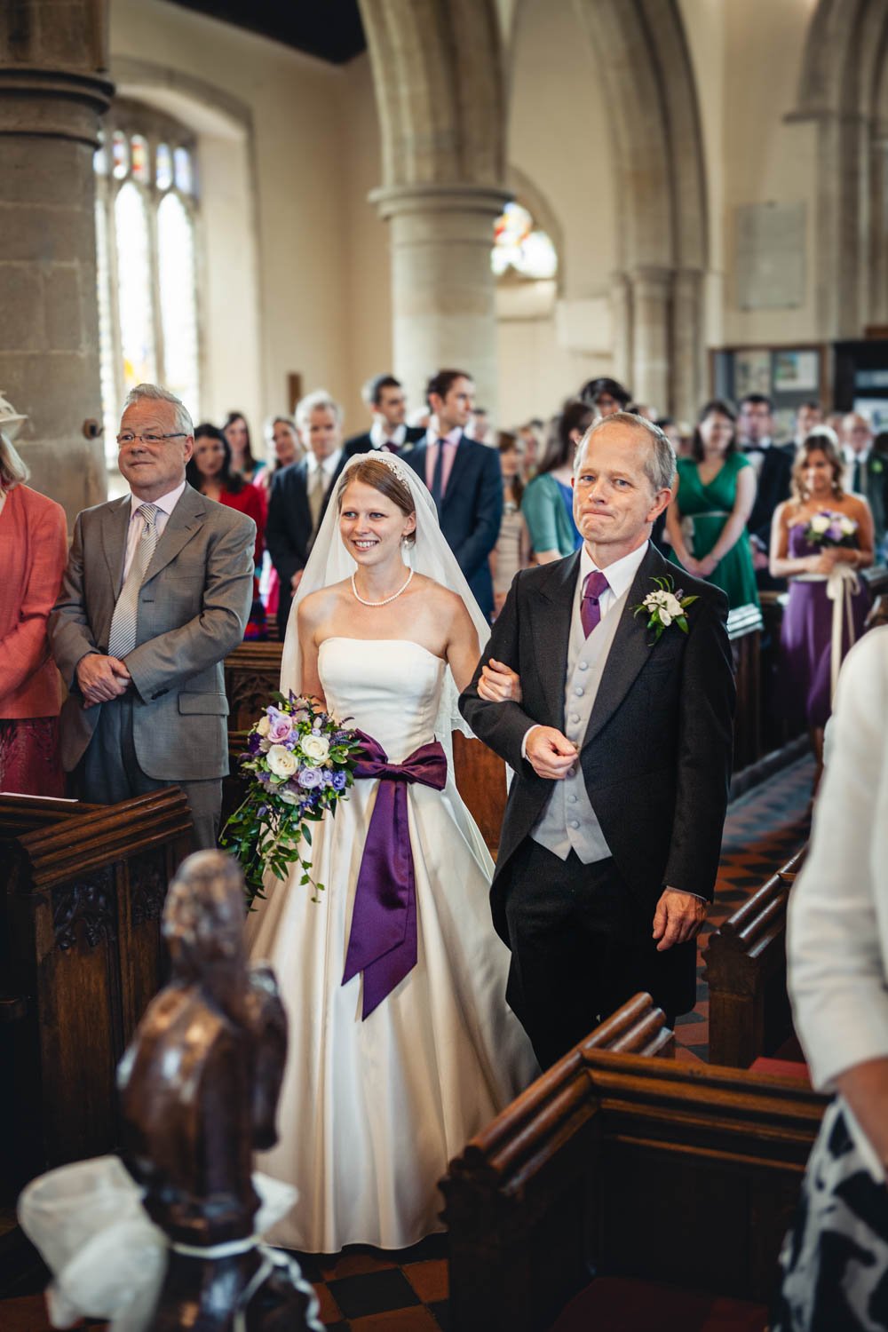 proud father walks the bride down the aisle in Haddenham church, Oxfordshire