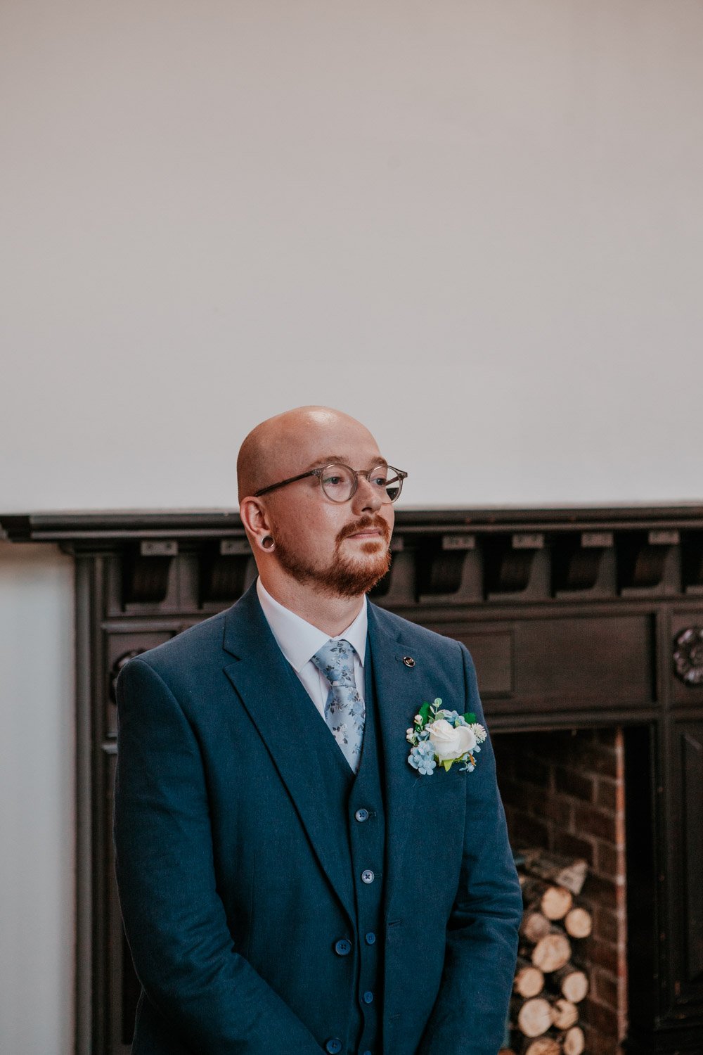 groom waits anxiously at the alter