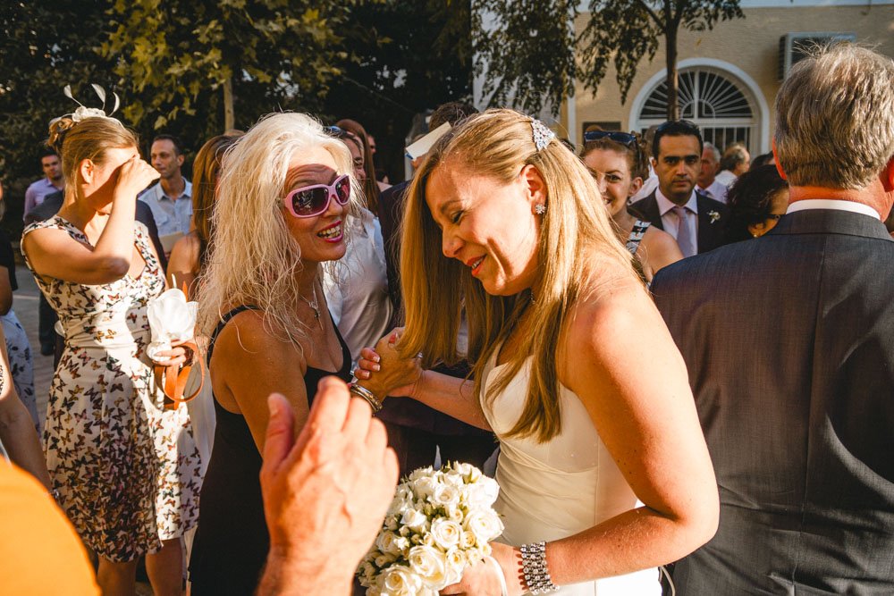 Bride greets guest at big fat Greek destination wedding in Athens
