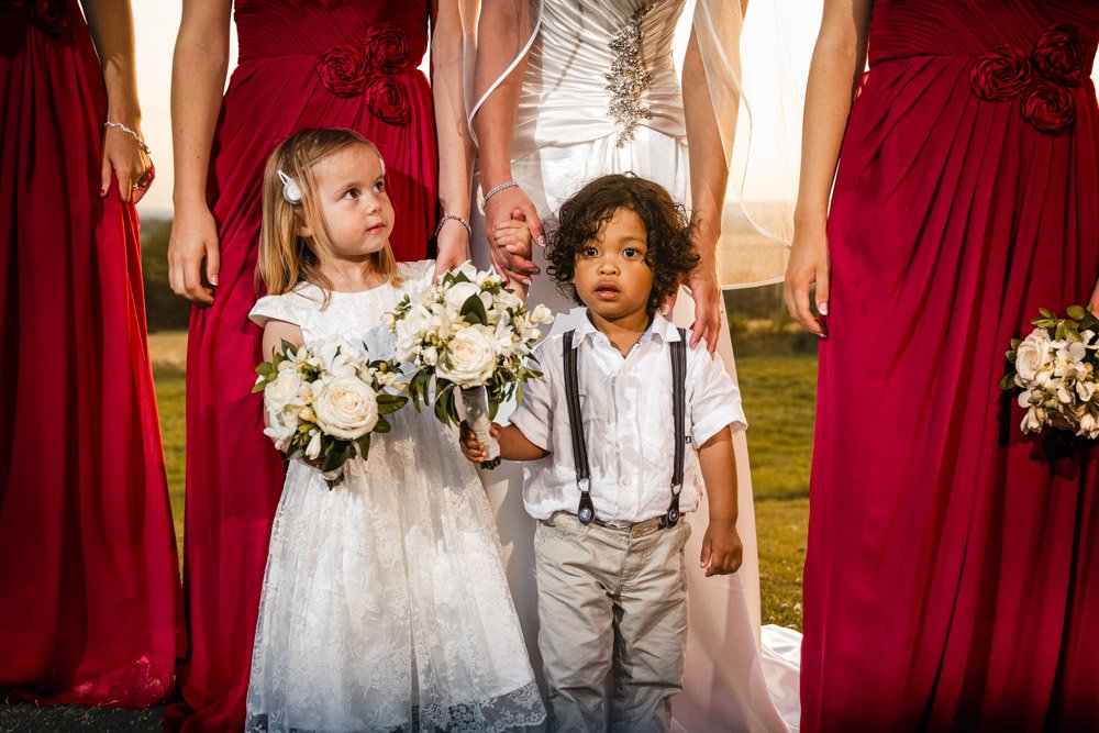 young bridesmaid with a smartly dressed boy