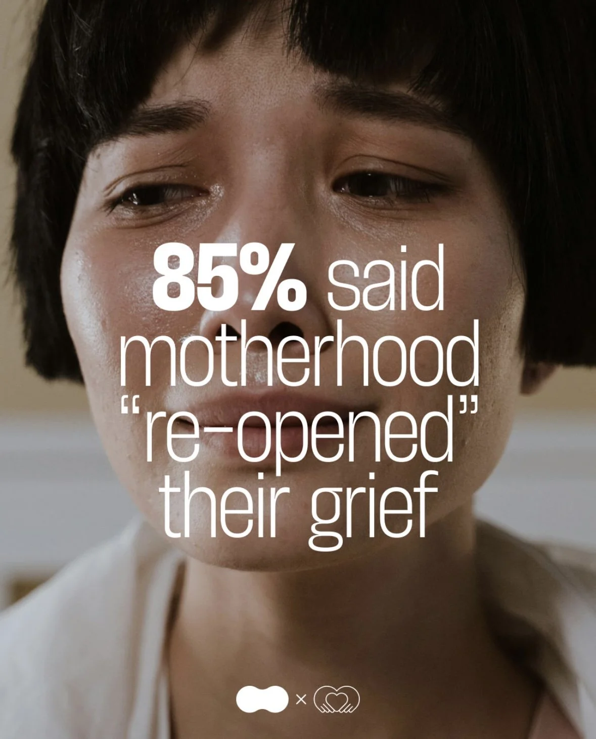 Close-up of a woman with teary eyes, emotional expression, with overlaid text about motherhood's impact on grief.