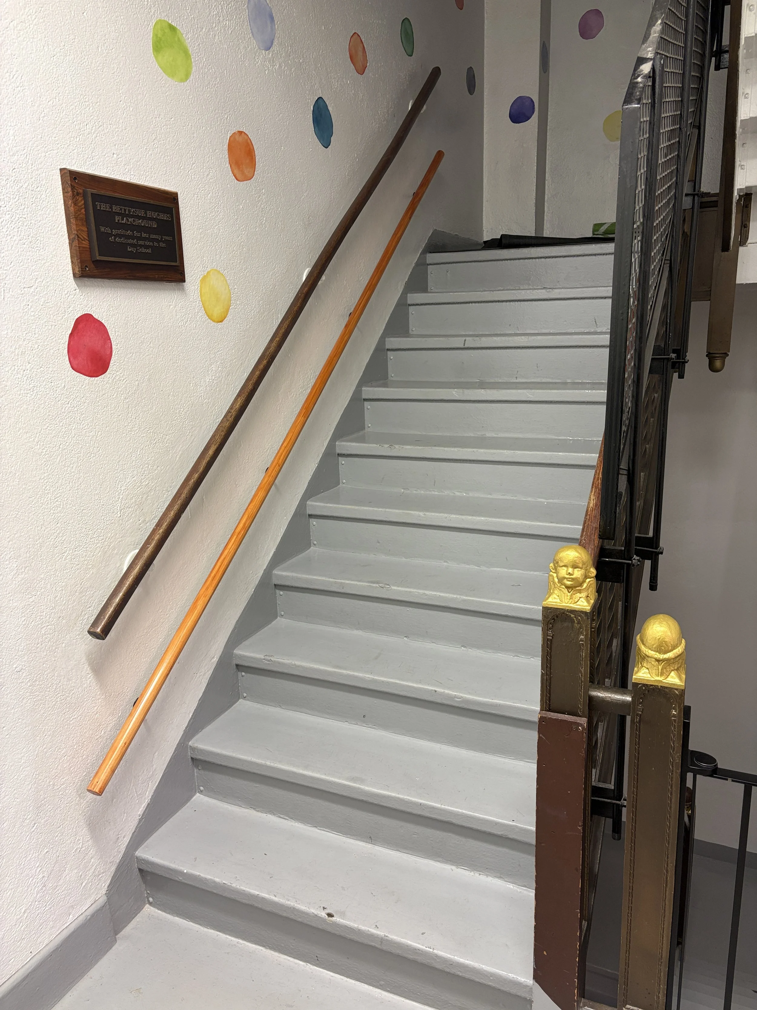 Stairwell handrail addition at an alternate height for children