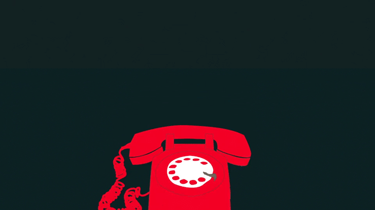 Red rotary telephone on a dark background.