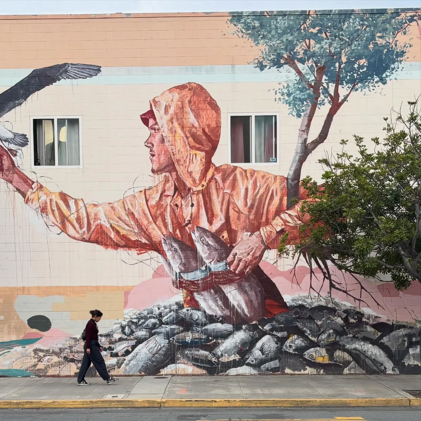 Palm trees and murals.