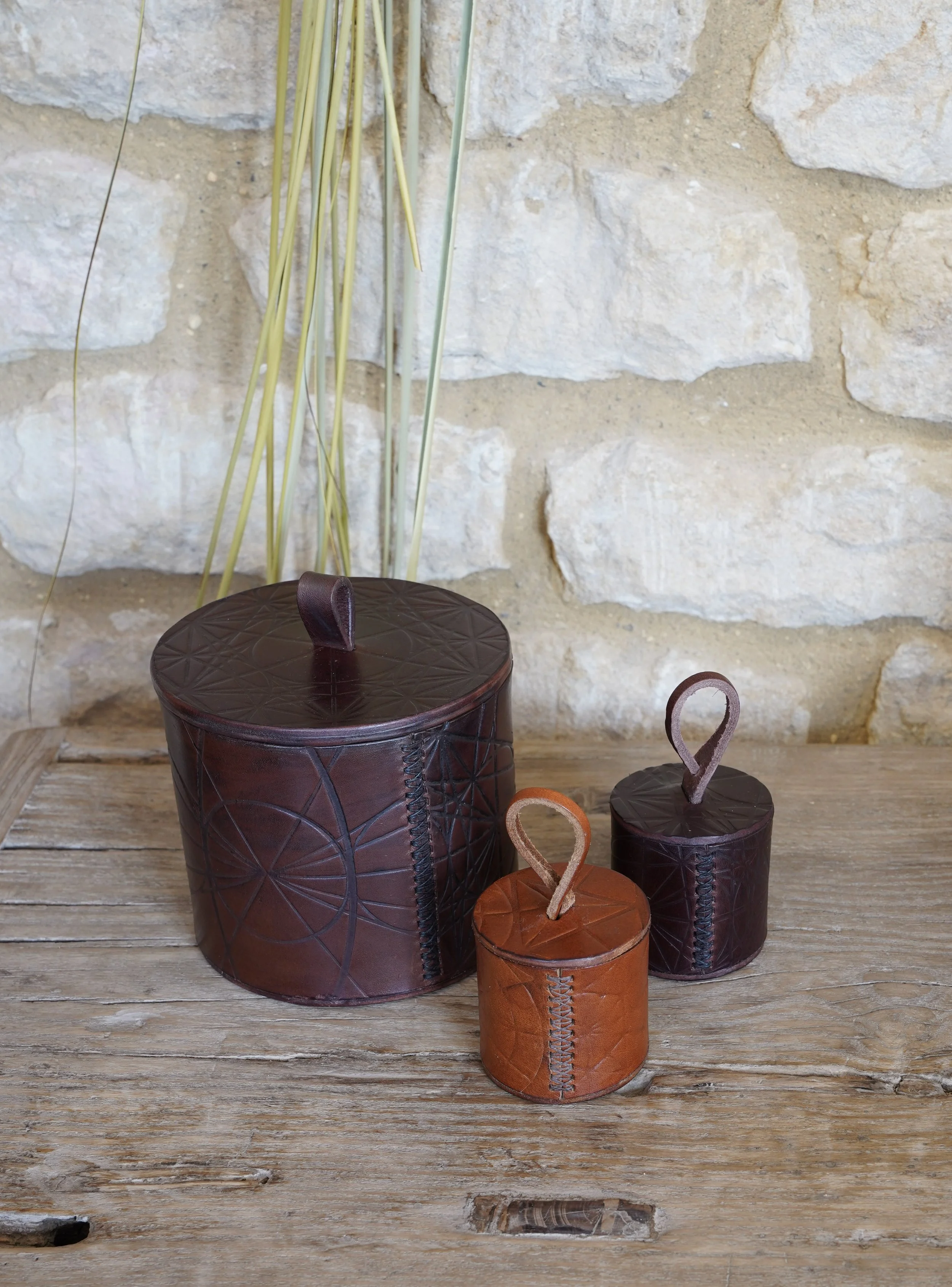 Justin Capp leather cylinder boxes.jpg