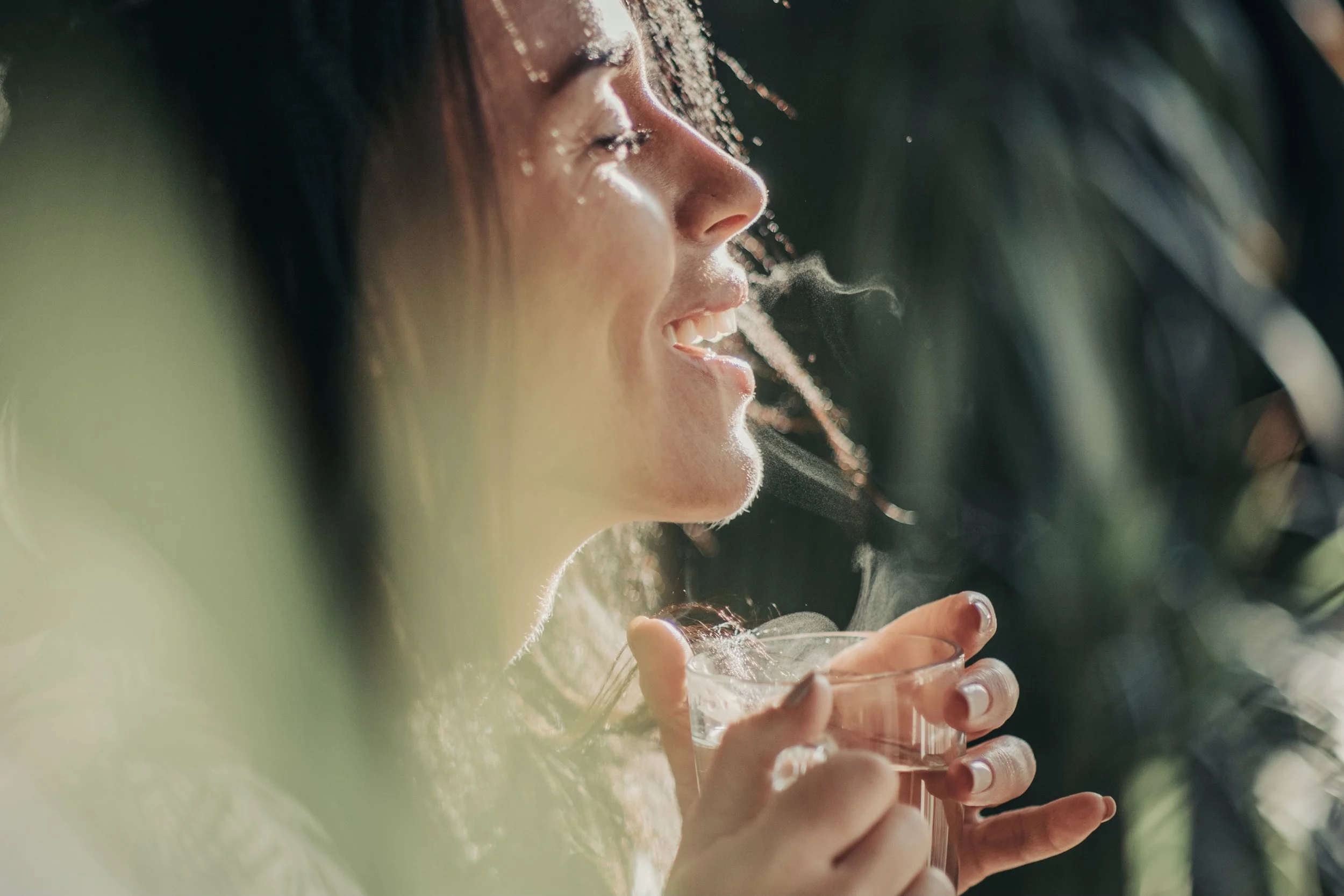 Happy patient with bright white smile after professional teeth cleaning